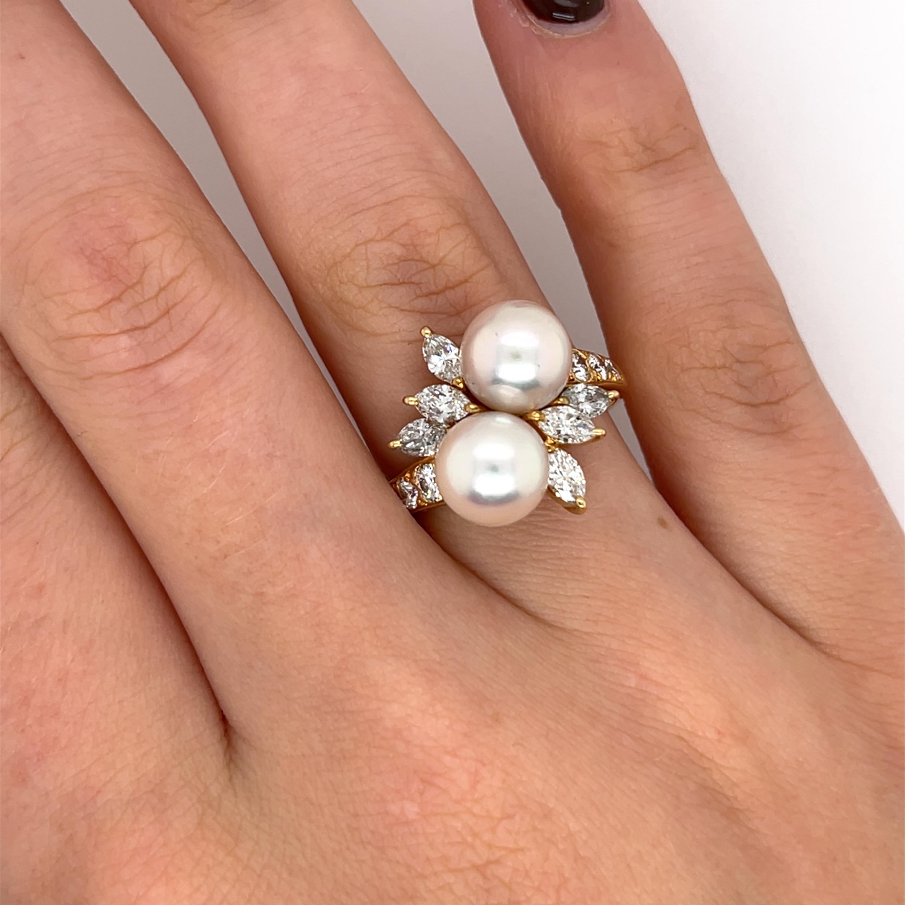 This elegant Mikimoto ring features two lustrous pearls 
and sparkling diamonds, set in 18ct yellow gold. 
The beautifully matched pearls, known for their exceptional quality, 
are complemented by a delicate arrangement of brilliant 
and marquise