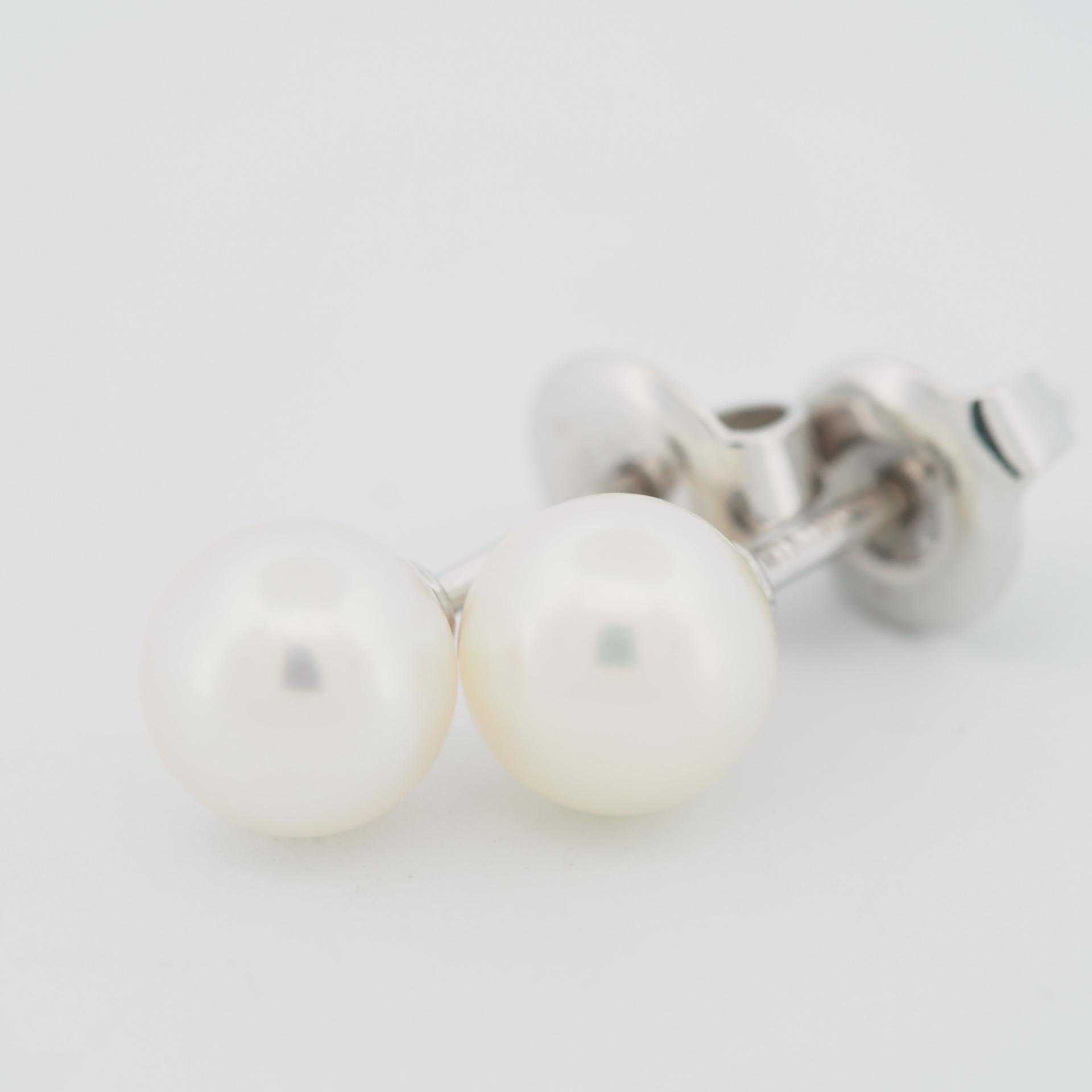 Item: Mikimoto Akoya Pearl Post Earrings
Stones: 6.2 mm Akoya Pearl
Metal: 18K White Gold
Weight: 1.6 Grams (total)
Condition: Used
Retail Price: ---
Signatures: MIKIMOTO, K18
Accessories: Inner Box (broken)

These are authentic Mikimoto Akoya Pearl