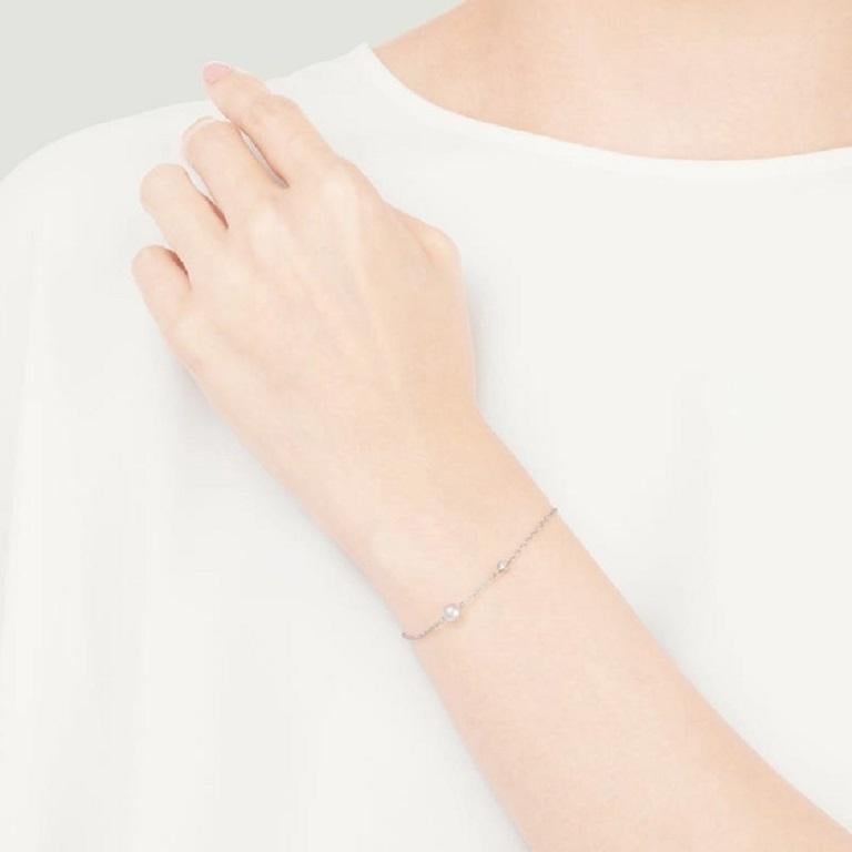 From the Station Collection, this bracelet features a 5mm Akoya cultured pearl and a 0.02 carat diamond set along the 18K white gold chain. There are 2 loops at the end of the chain where you can fasten the clasp for a perfect fit on your