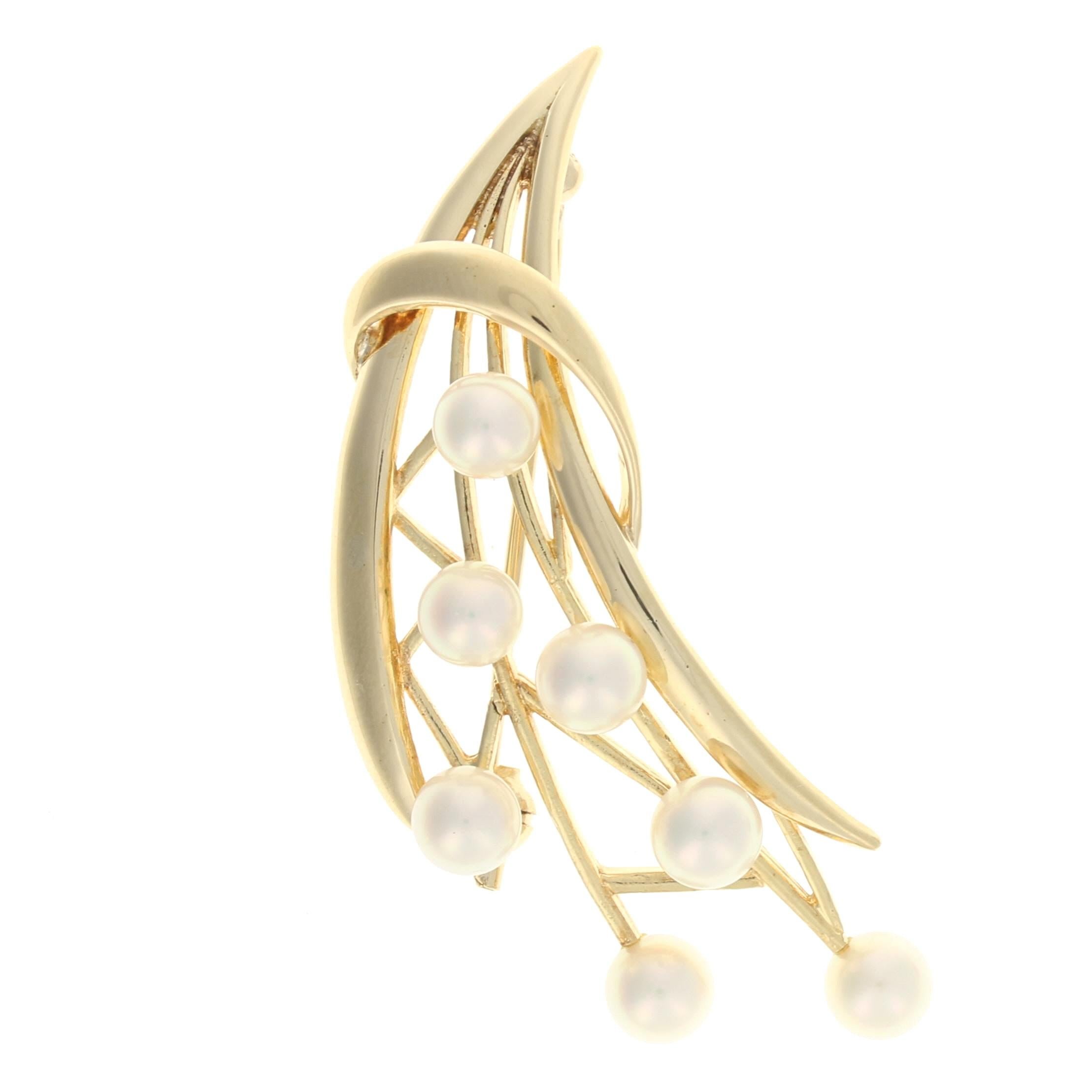 Brand: Mikimoto

Metal Content: 14k Yellow Gold

Stone Information: 
Genuine Akoya Pearls
Diameter Range: 5mm - 5.3mm

Style: Brooch
Closure Type: Hinged Pin and Whale Tail Clasp
Theme: Floral Spray

Measurements: 
Tall: 1 1/4