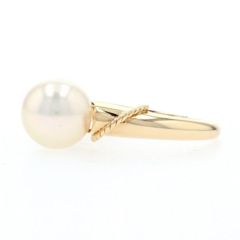 Featuring a subtle, nautical-inspired design, this 18k yellow gold Mikimoto ring showcases a luminous Akoya pearl solitaire sweetly accented by rope detailing which wraps across the ring’s polished shoulders. This designer piece is elegantly