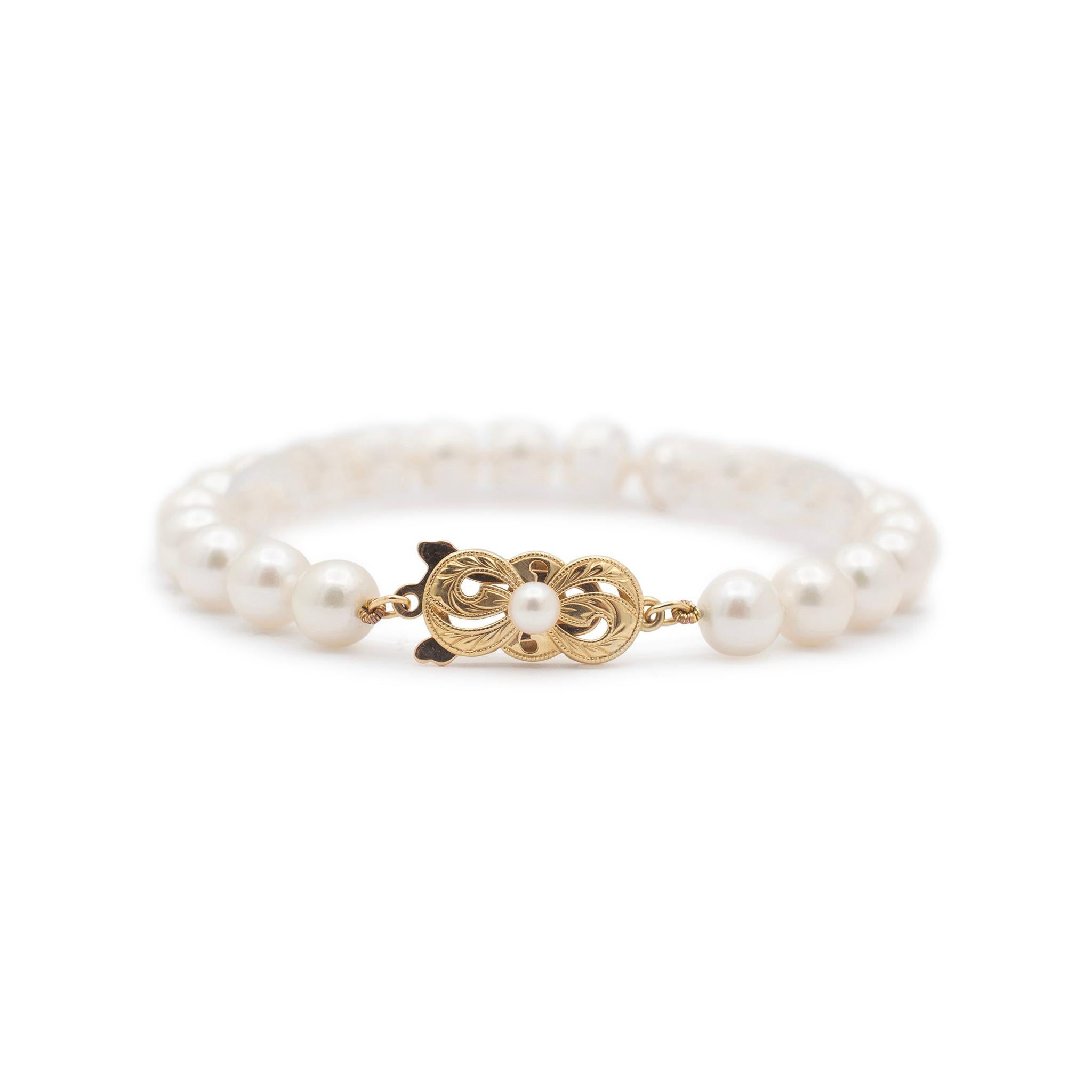 Brand: Mikimoto

Gender: Ladies

Metal Type: Yellow Gold

Length: 6.50 inches

Weight: 11.91 grams

One lady's knotted single-strand uniform pearl bracelet. The clasp metal was tested and determined to be 18K yellow gold. Engraved with 