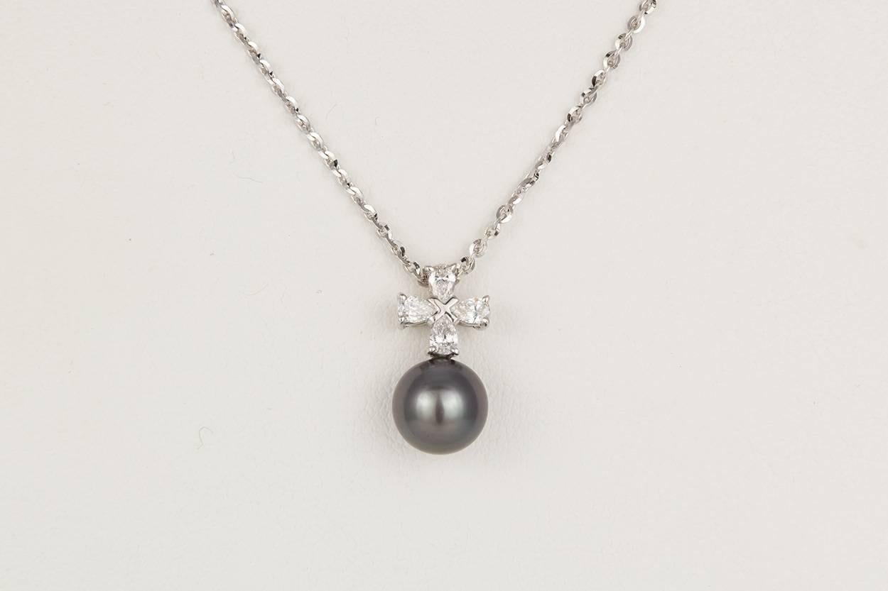 We are pleased to present this Authentic Mikimoto 18k White Gold, Diamond & Black South Sea Pearl Pendant Necklace. This beautiful pearl pendant features an 8.5mm South Sea Pearl accented by 0.30ctw E-F/VVS-VS Pear Cut Diamonds all set in 18k White