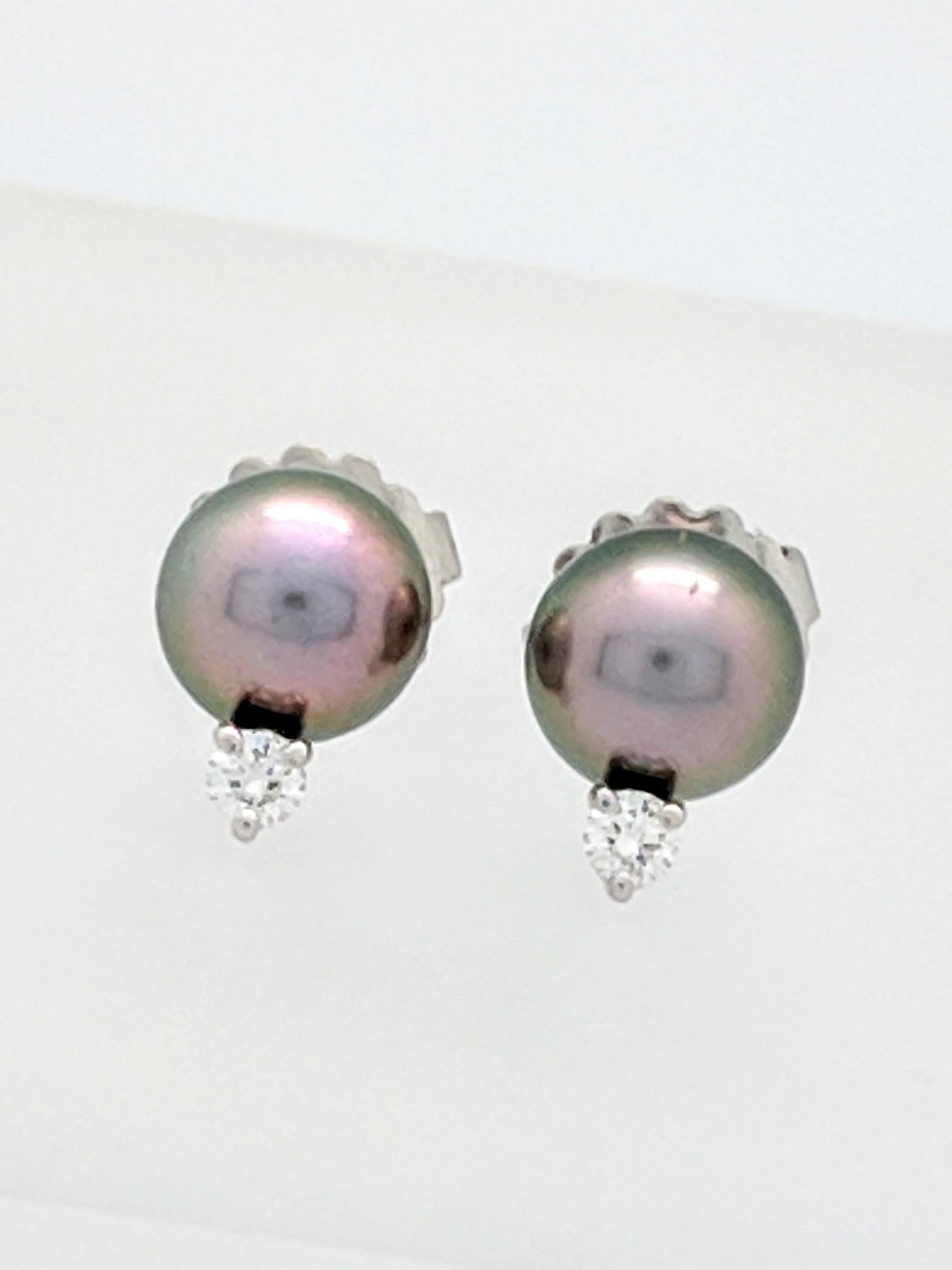 You are viewing a Stunning Pair of Mikimoto Black South Sea Stud Earrings with Diamonds. 

Each earring features (1) 9mm black south sea cultured pearl with .10ct diamond, set in 18k white gold. 

Retail $2730

These earrings come to you in