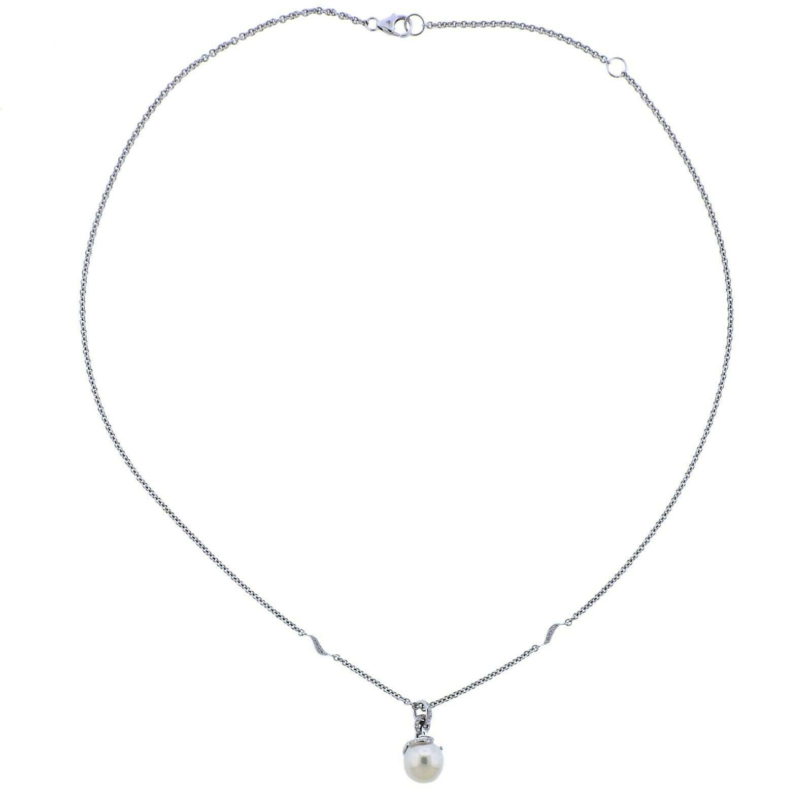 New Mikimoto 18k white gold pendant necklace, with 8.9mm A+ pearl and approx. 0.15ctw in G/VS diamonds. Retail $3200. Comes with box.  Necklace is 18
