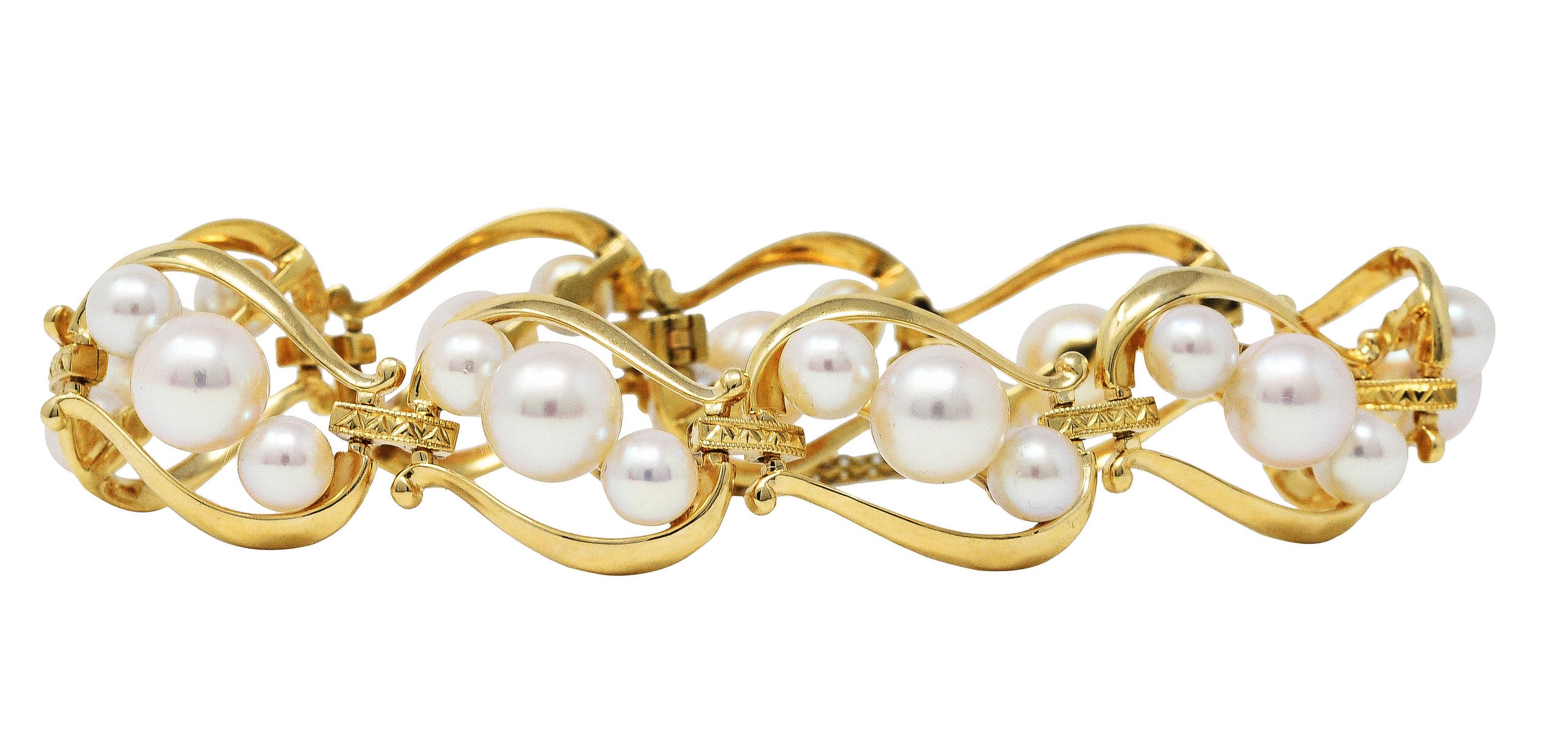 Bracelet is designed as scrolling articulated links

Alternating with bar spacer links - chevron engraved

Each link features three cultured pearls ranging in size from 7.3 mm to 5.2 mm

Pearls are cream in body color with strong rosè overtones and