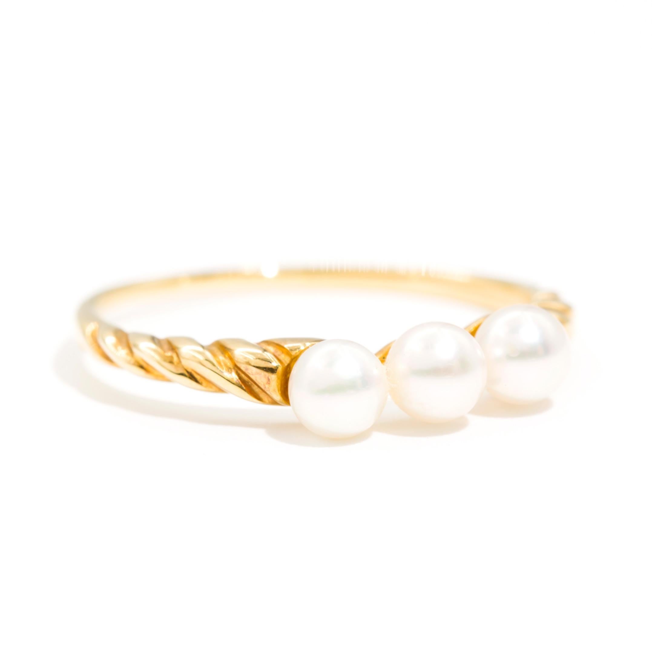Carefully crafted in 18 Carat yellow gold is this ever so sweet vintage Mikimoto three pearl ring. Each lustrous cultured pearl measures approximately 3.8 millimetres, and are beautifully set side by side. This gorgeous Mikimoto ring invokes