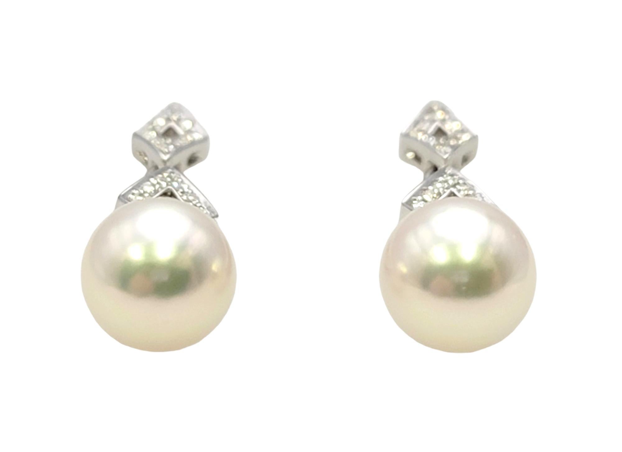 Utterly timeless diamond and pearl earrings by renowned jeweler, Mikimoto. Mikimoto is an international luxury company, recognized as the first producer of cultured pearl jewelry. The worldwide brand is known for its superior craftsmanship,