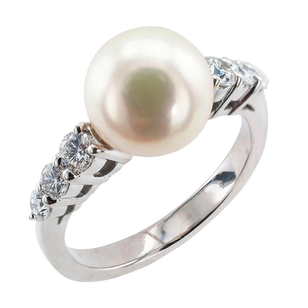 Estate Mikimoto cultured pearl and diamond  white gold ring.

DETAILS:
GEMSTONES:  one round cultured pearl measuring approximately 8.4 mm.

DIAMONDS:  six round brilliant-cut diamonds totaling approximately 0.30 carat, approximately F – G color,