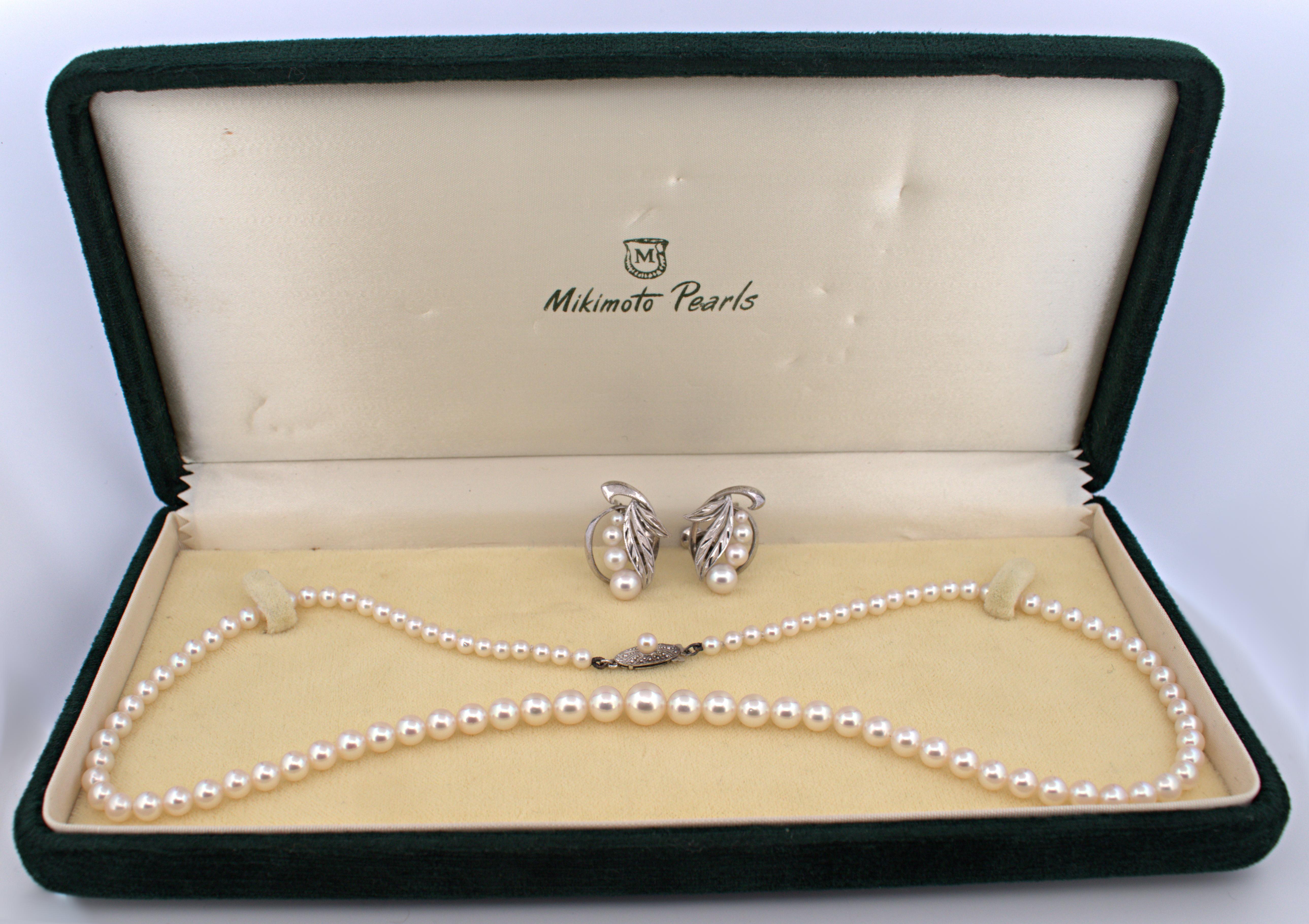 Including one necklace, composed of (97), graduated, lustrous, cultured Mikimoto pearls, ranging from
7.10 mm to 3.40 mm, completed by a silver Mikimoto fish hook clasp, forming a 17.5 inch, unknotted
necklace; together with a matching pair of