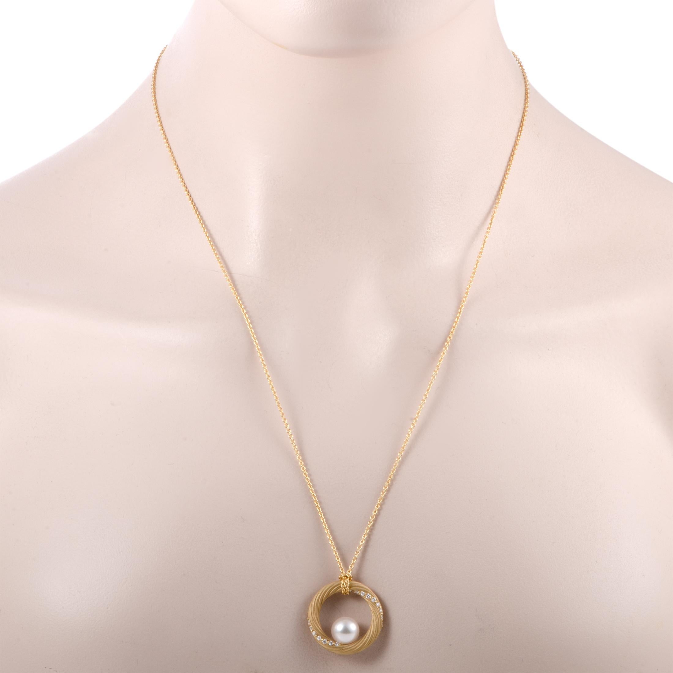 This glamorous 18K yellow gold necklace by Mikimoto exhibits a sensationally alluring style and an extravagantly feminine appeal. Its gorgeous pendant features 0.40ct of dazzling diamonds and magnificent Akoya pearls of 9-9.5 mm that accentuate the