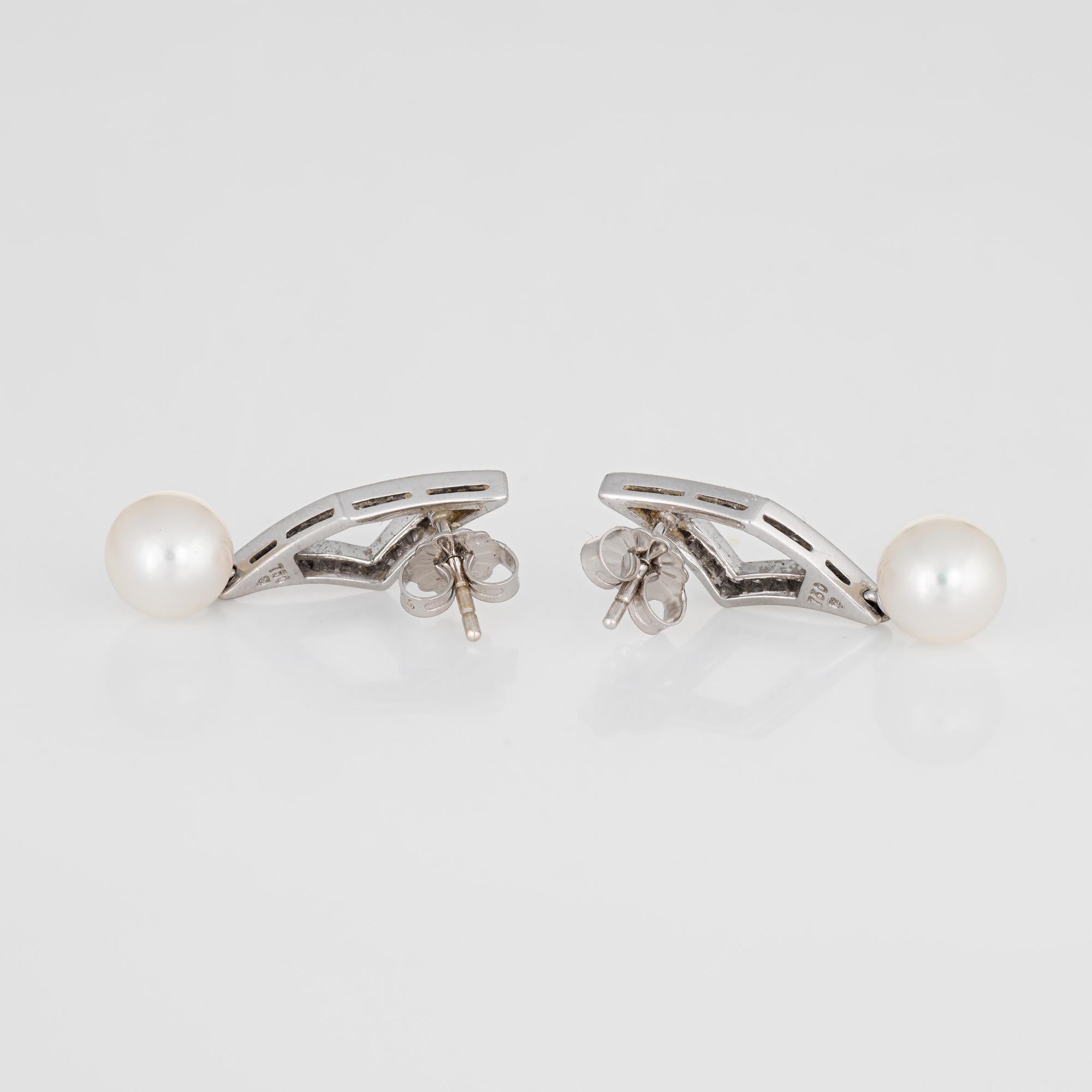 Elegant pair of Mikimoto cultured Akoya pearl & diamond earrings crafted in 18k white gold. 

Two 7.5mm cultured Akoya pearls are accented with an estimated 0.24 carats of diamonds (estimated at G-H color and VS clarity). The pearls are lustrous and