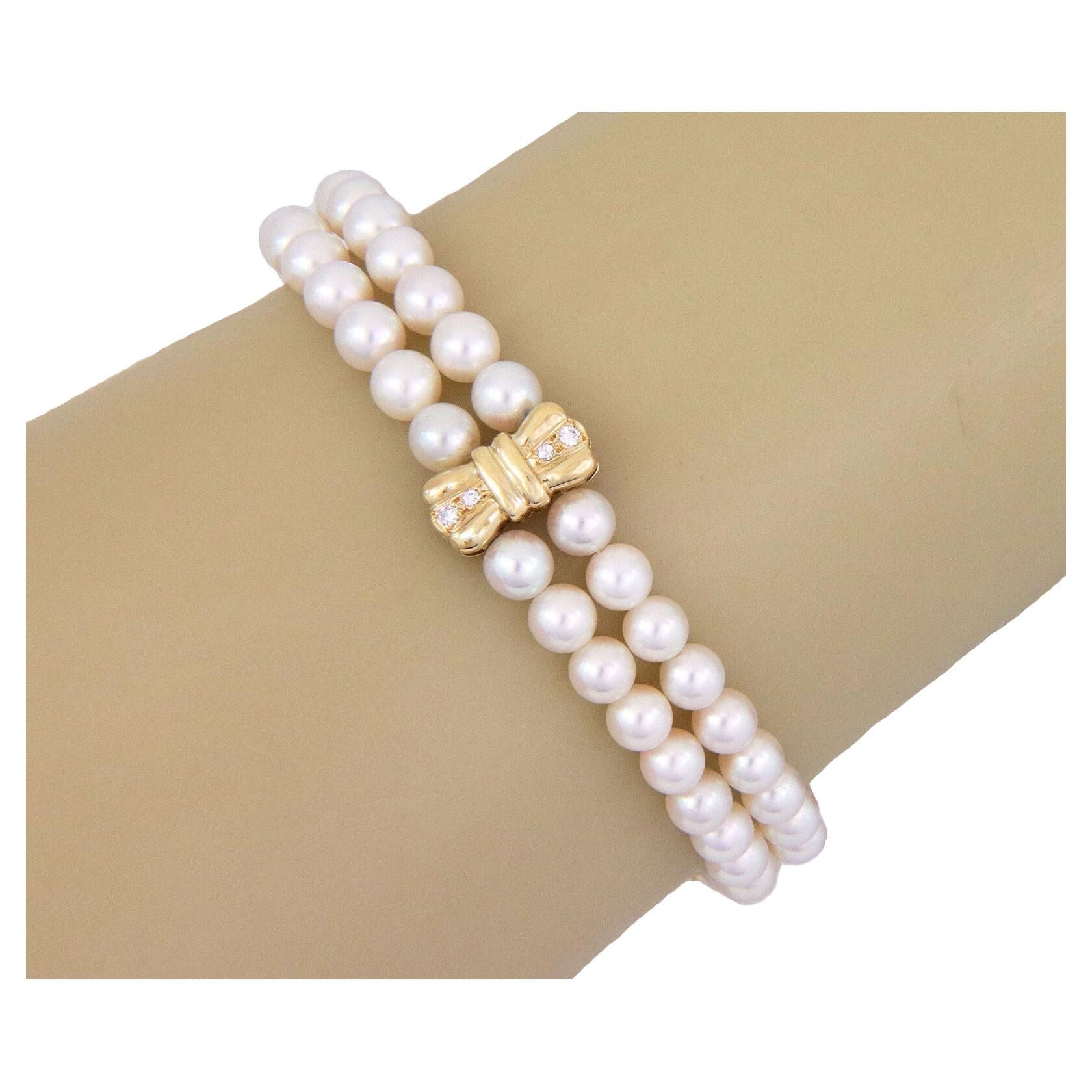 Mikimoto Bracelet à 2 rangs à motif de nœud en or jaune 18 carats avec perles et diamants