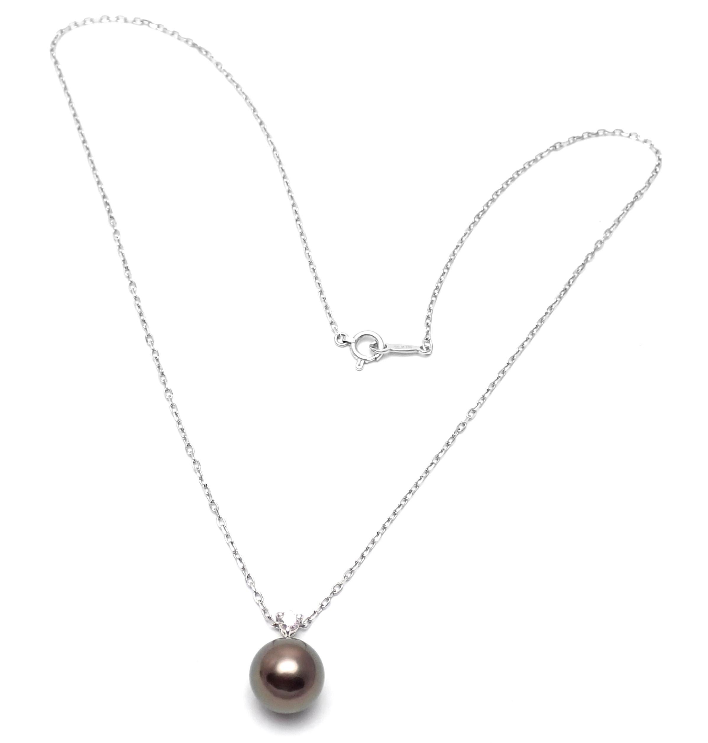 18k White Gold Diamond Tahitian Black Pearl Pendant Necklace by Mikimoto. 
With 1 round brilliant cut diamonds VS1 clarity, E color total weight approximately .10ct
1 Tahitian black pearl 10mm
Details:
Necklace length: 15