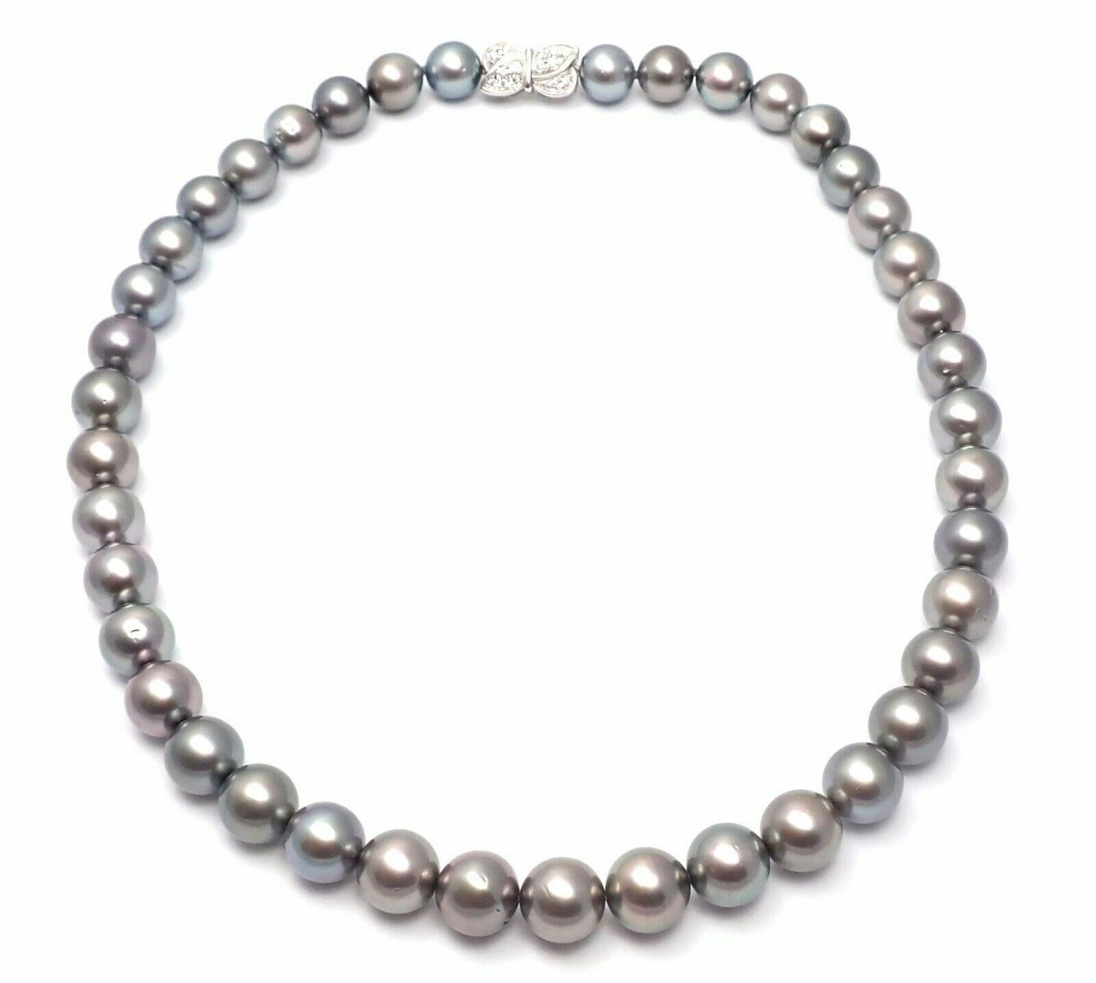 18k White Gold Diamond Tahitian Black South Sea Pearl Necklace by Mikimoto. 
With 14 Round brilliant cut diamonds
total weight .28ct
41 Tahitian Black South Sea black pearls from 9.5mm to 11mm
Details:
Necklace length: 16.5