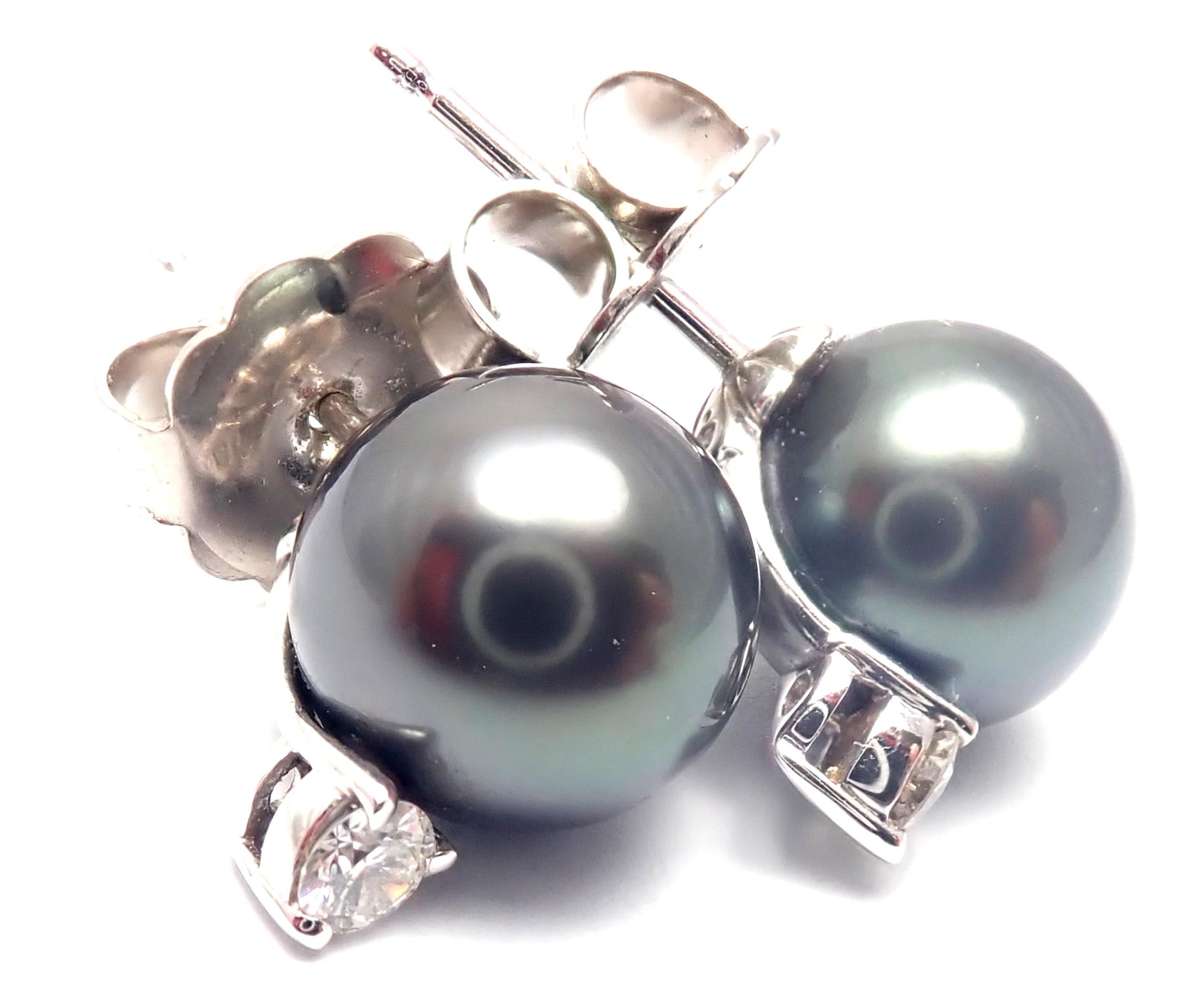 18k White Gold Diamond 10mm Tahitian Black South Sea Pearl Earrings by Mikimoto. 
With 2 round diamonds VS1 clarity, G color total weight approximately .20ct
2 Tahitian Black South Sea black pearls 10mm each
These earrings are made for pierced