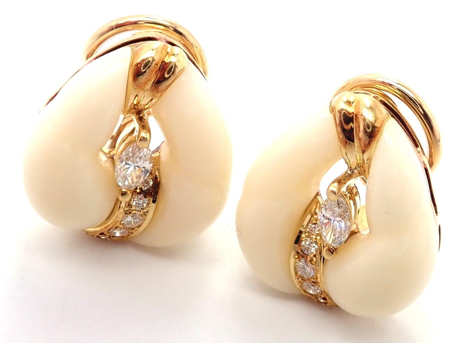 18k Yellow Gold Diamond White Coral Earrings by Mikimoto. 
With 2 marque shape diamonds and 10 round brilliant cut diamonds VS1 clarity, E color total weight approximately .30ct
Details: 
Measurements: 19mm x 16mm
Weight: 10.4 grams
Stamped