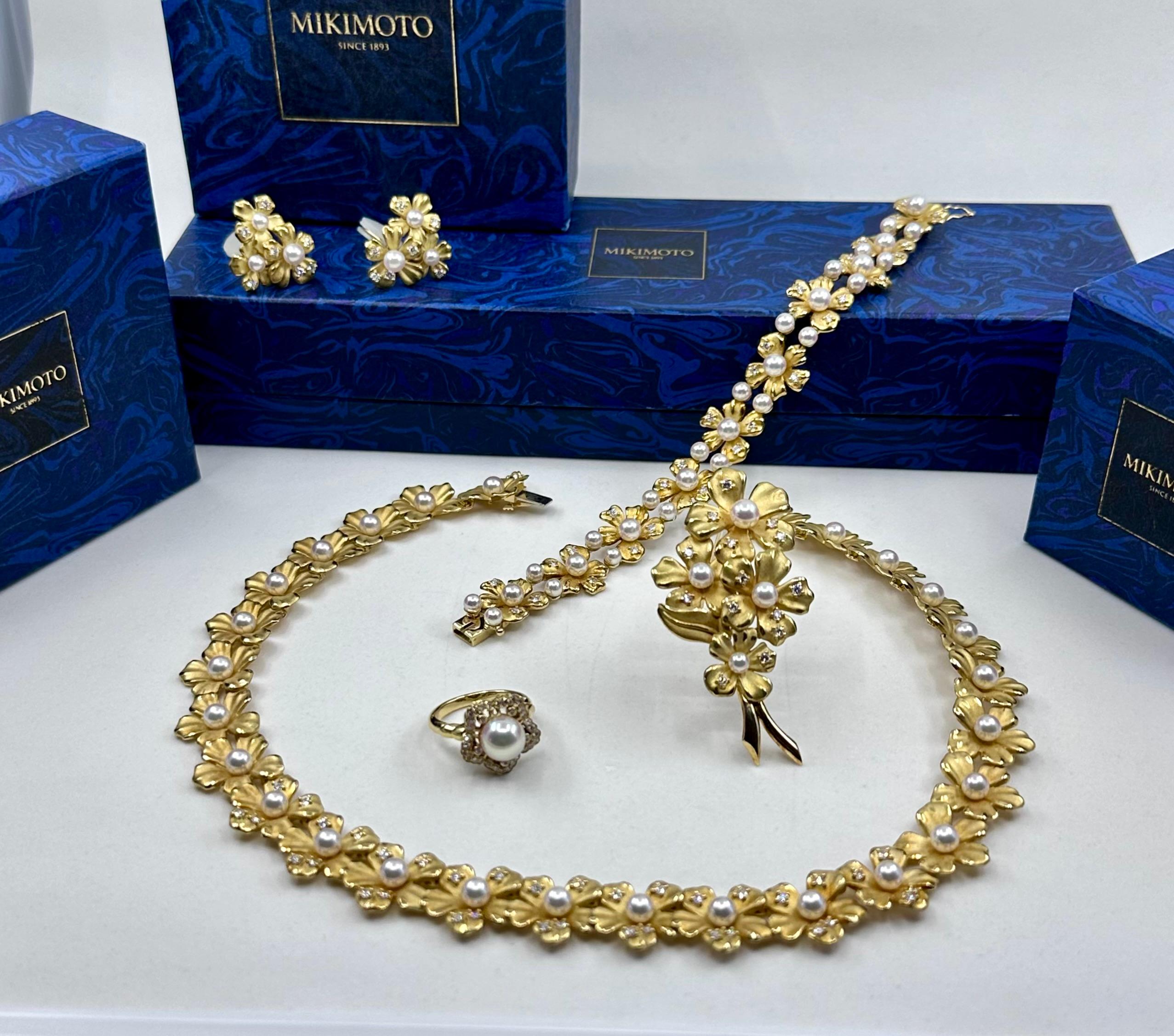 A complete suite of Mikimoto Jewelry
 18 Kt Yellow Gold Diamond and Pearl Necklace Bracelet Earring, Ring and Brooch circa 1960s
Diamonds: 90 Fine D E Color Diamond 3.50 cts Total Weight
Gram Weight 153 g of 18k Gold 
Necklace is 17 inch