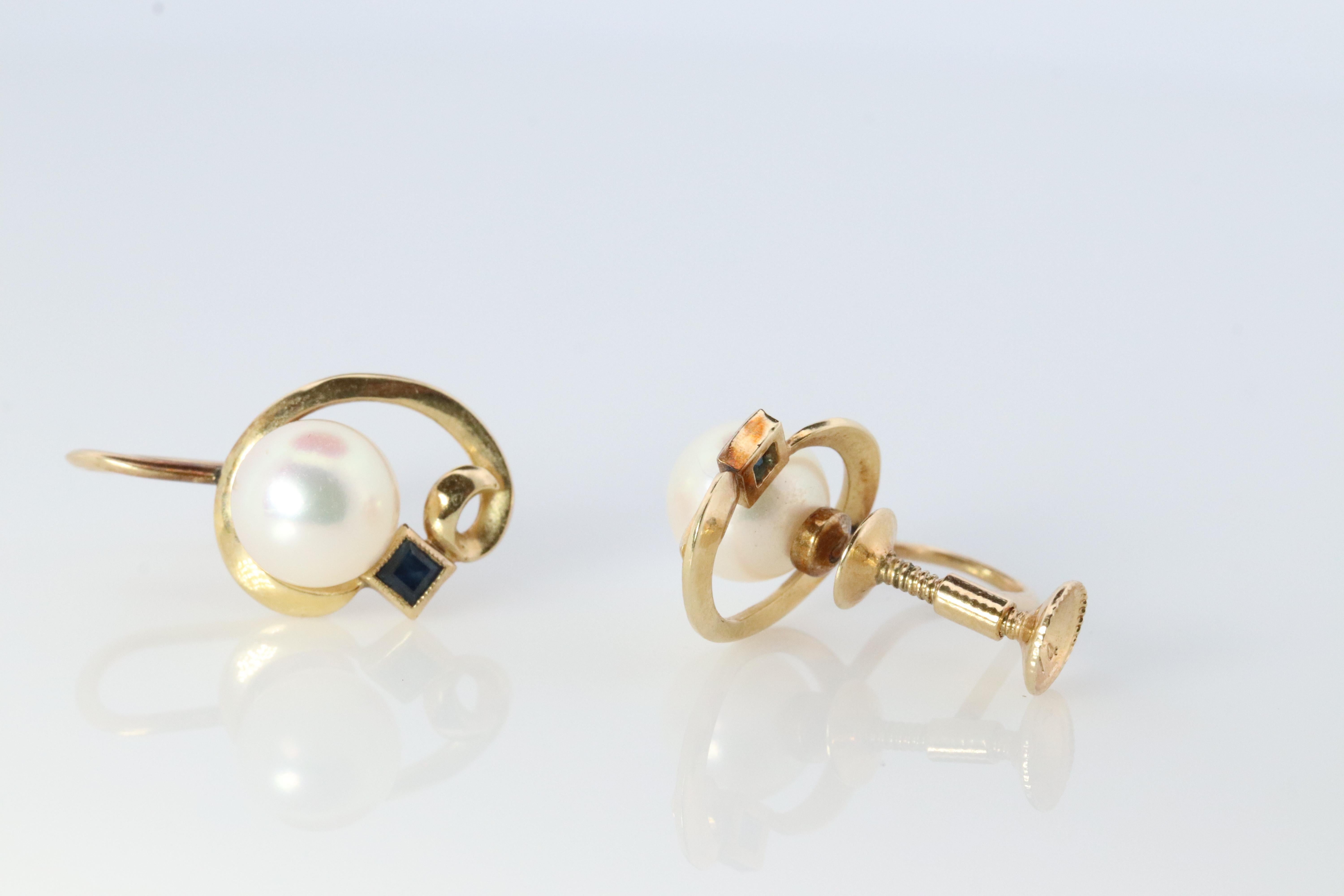 Stunning Designer earrings. World Renowned MIKIMOTO pearls. A Akoya pearls with Sapphires designed for unpierced ears.

Pearls have amazing luster. Mid-century design. 
Princess cut sapphire

Screw Backs.
Condition: Shows limited signs of