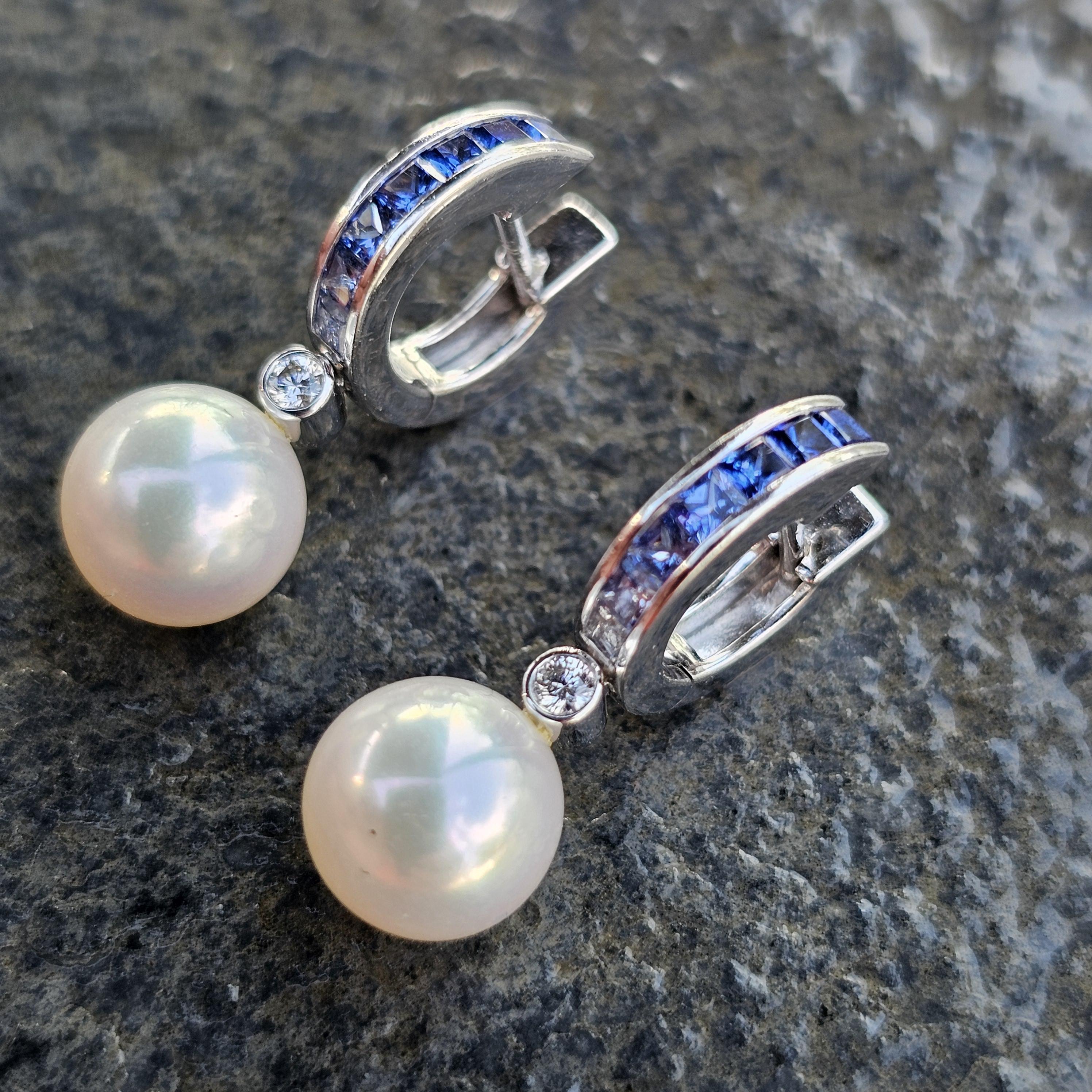 Enhance your elegance with these exquisite Mikimoto hoop and dangle earrings. Crafted from 18k white gold, these earrings showcase a harmonious blend of luxury and sophistication. The primary stone is a lustrous pearl, exuding timeless beauty.