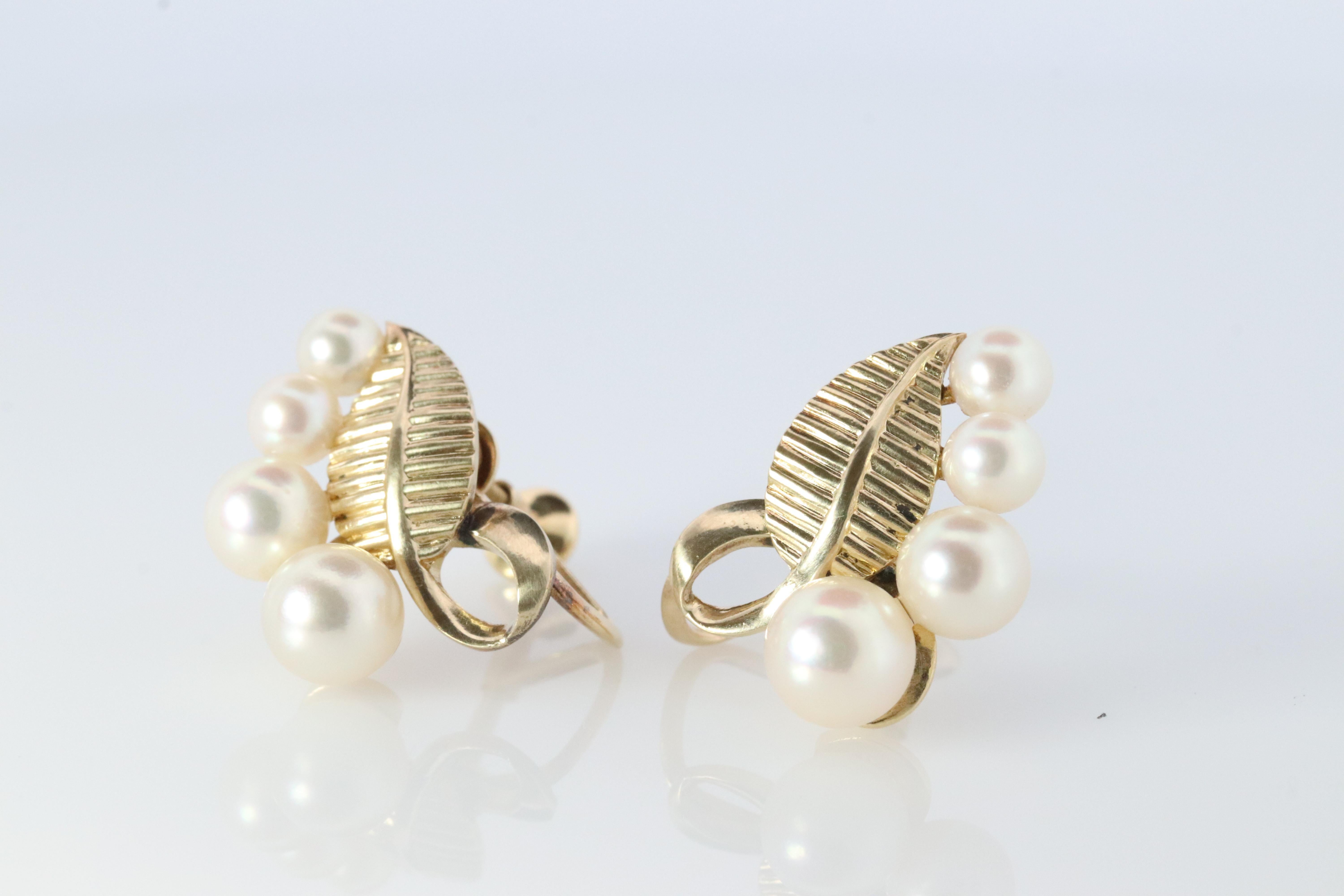 Stunning Designer earrings. World Renowned MIKIMOTO pearls. A cluster of Akoya pearls designed for unpierced ears.

Pearls have amazing luster. Mid-century design with Leaves.

Screw Backs.
Condition: Shows no signs of wear

Details:
4mm to 6mm