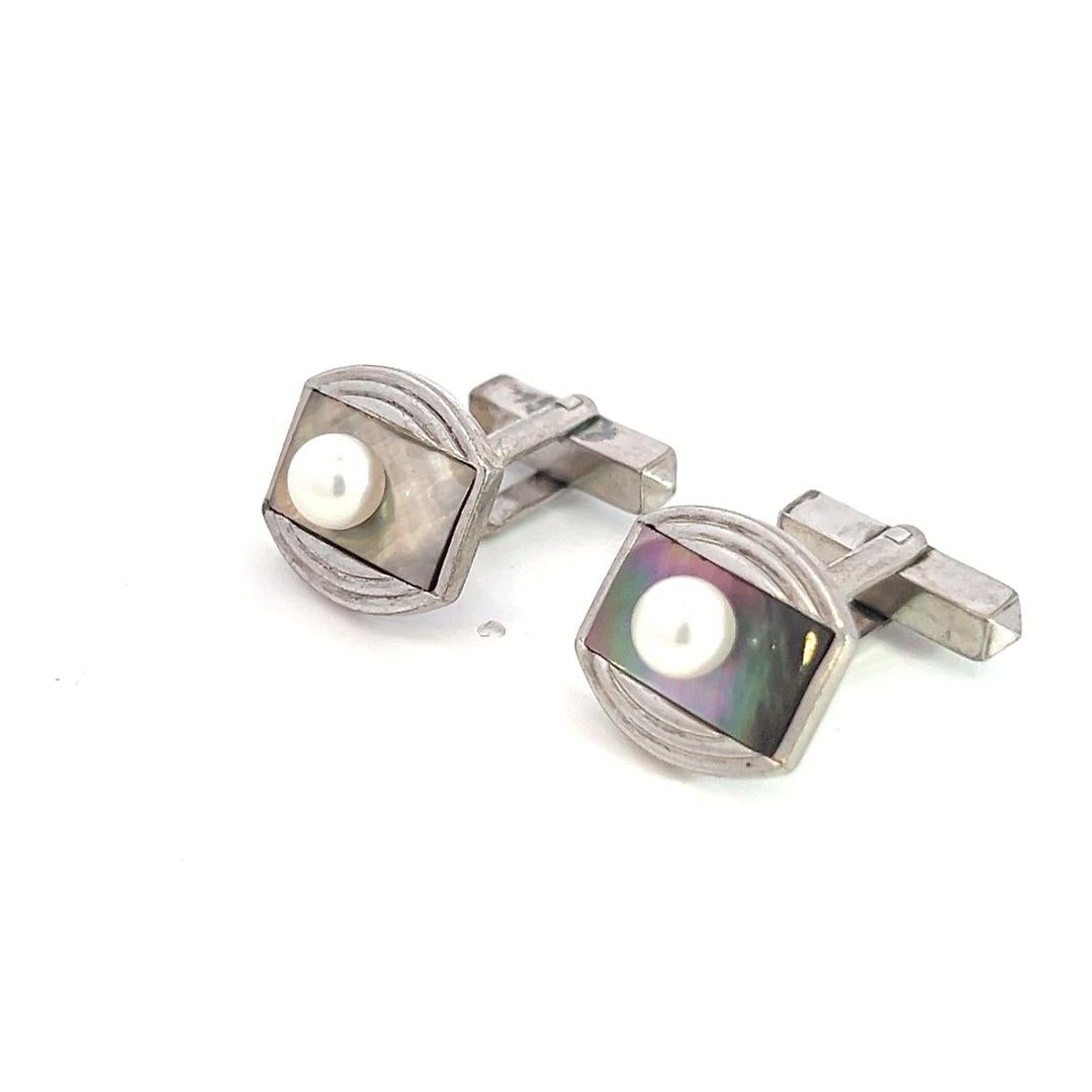 Mikimoto Estate Akoya + Mother of Pearl Cufflinks 5.2 mm Sterling Silver M381

TRUSTED SELLER SINCE 2002

PLEASE SEE OUR HUNDREDS OF POSITIVE FEEDBACKS FROM OUR CLIENTS!!

FREE SHIPPING

This elegant Authentic Mikimoto Men's Sterling Cufflinks has 2