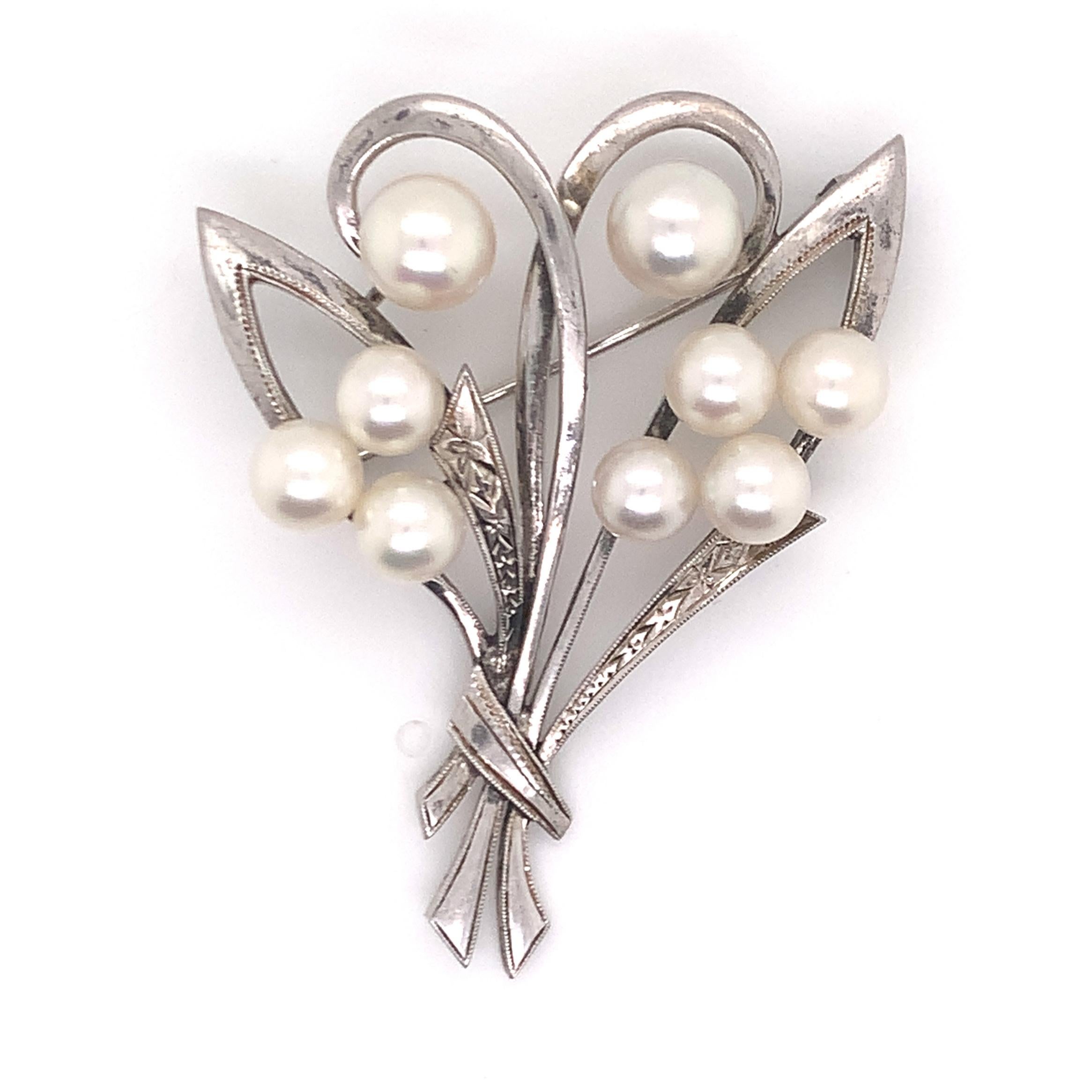 silver and pearl brooch