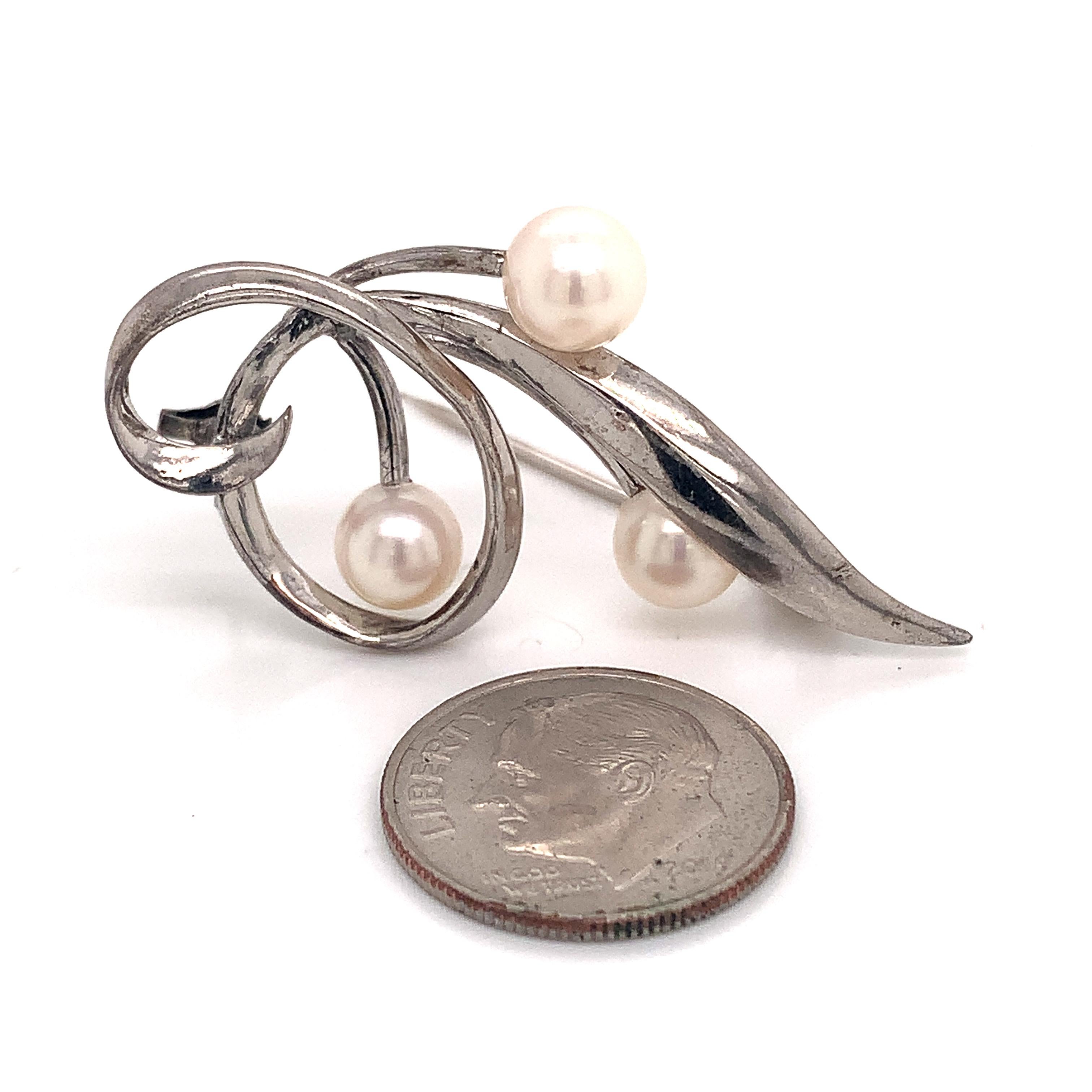 silver and pearl brooch