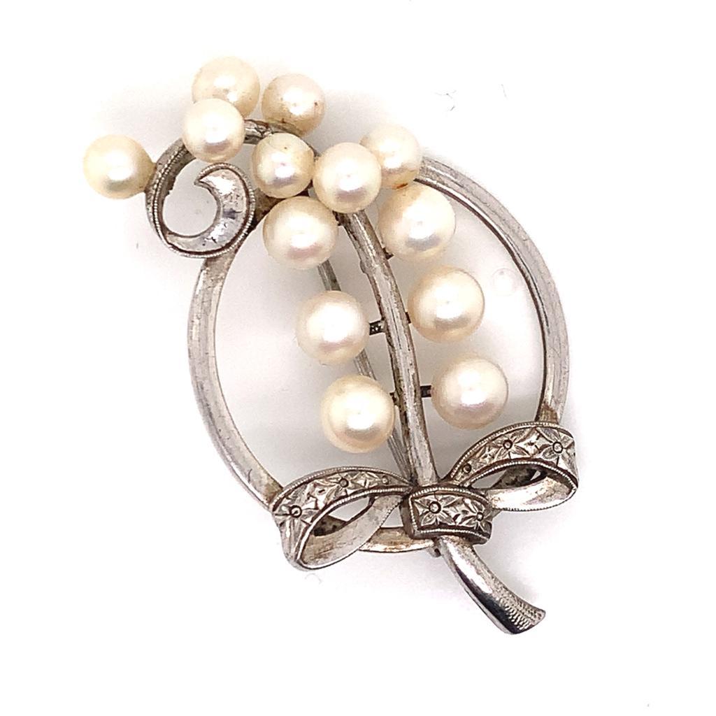 Mikimoto Estate Pin Brooch Sterling Silver 7.47 Gr 5.50 mm M164

This elegant Authentic Mikimoto Estate sterling silver brooch has 13 Saltwater Akoya Cultured Pearls ranging in size from 4.48 - 5.50 mm with a weight of 7.47 Grams.

TRUSTED SELLER