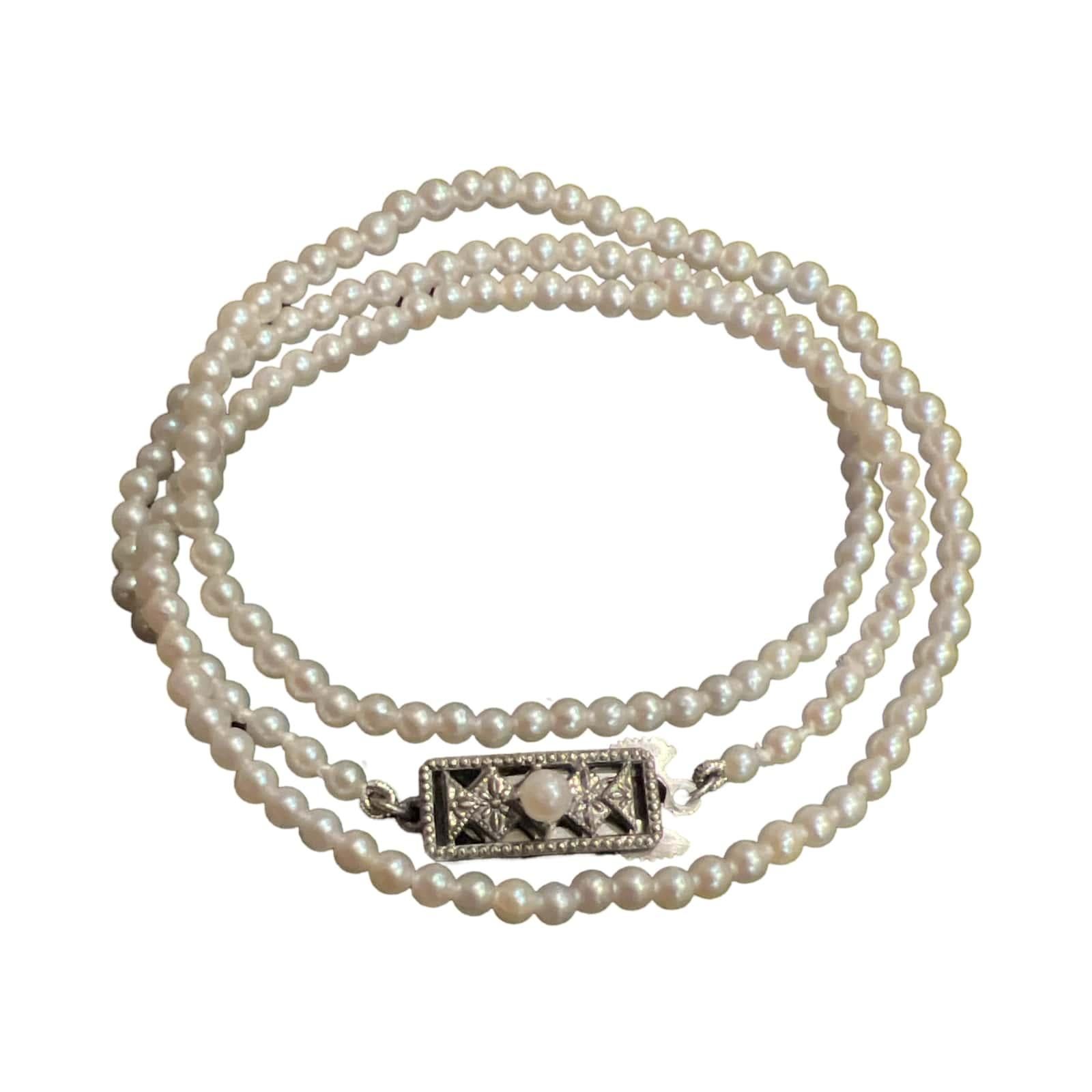 Mikimoto Estate Very Rare Baby Akoya Pearl necklace made with 2.5 mm appx baby Akoya pearls with a length of 16 inches secured with a classic Mikimoto Sterling Silver Clasp M405

This elegant Authentic Mikimoto necklace is made of Saltwater Akoya