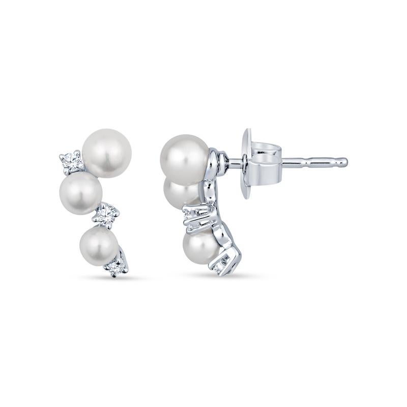 These earrings from Mikimoto feature six graduating Akoya pearls measuring 3.25mm, 3.75mm and 4.25mm accented by scattered round diamonds. set in 18 karat white gold. These come with the original Mikimoto box. 
Measurements: Length approximately