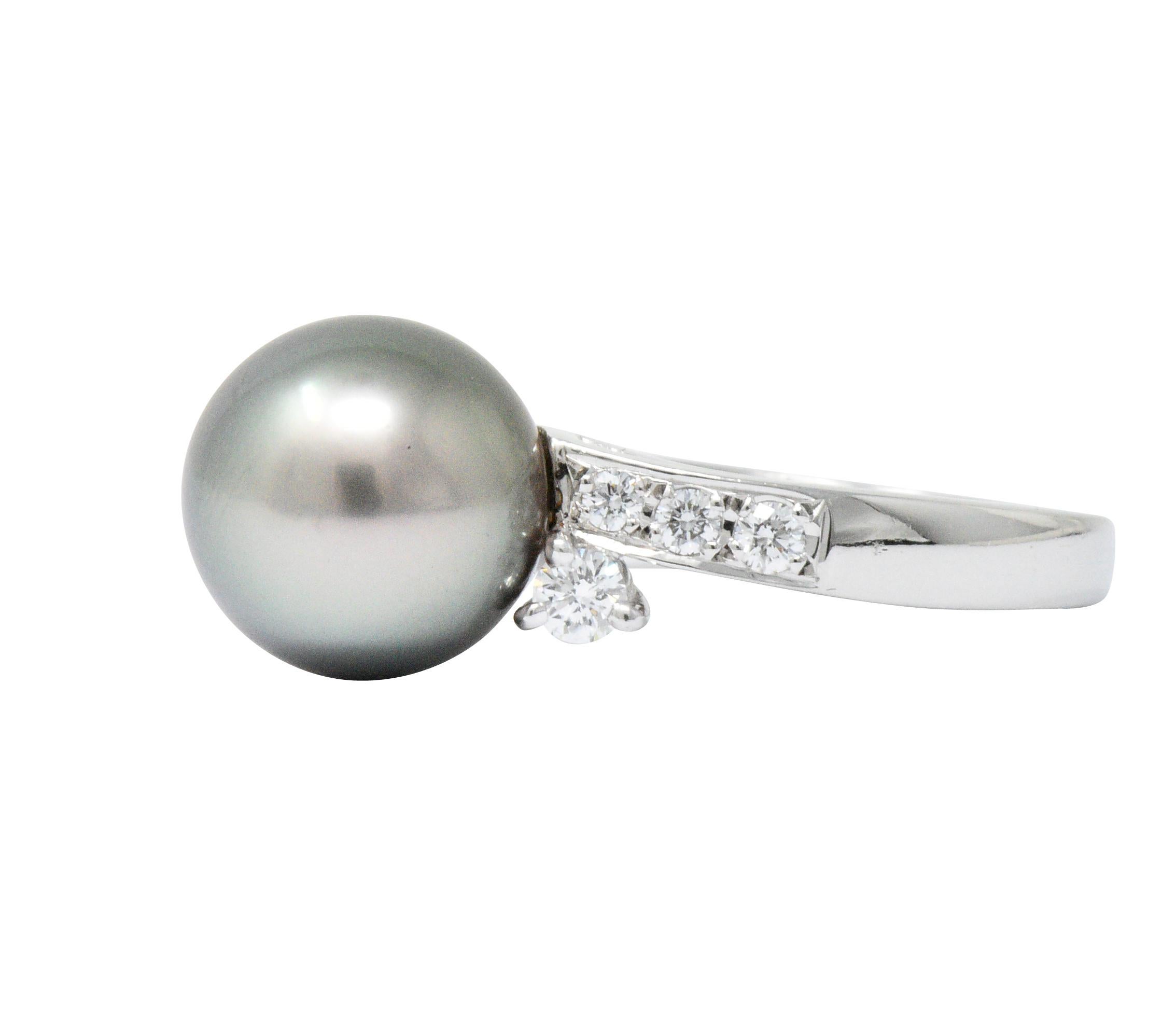 Featuring an 11 mm gray South Sea Pearl with purplish hues and great luster 

Accented by 8 round brilliant diamonds weighing approximately 0.40 carats, F-G color and VS clarity

Circa 1990

Stamped PT 950 for platinum with Mikimoto makers