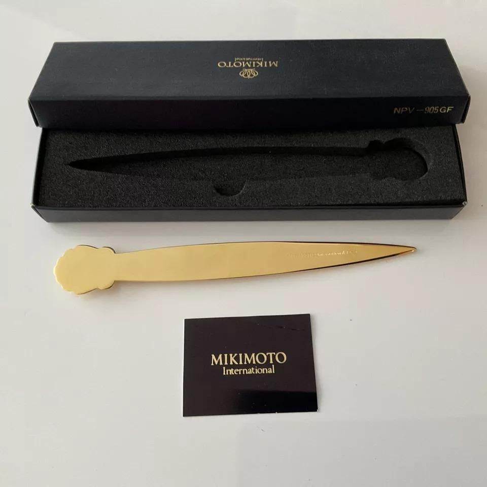 This Mikimoto letter opener is not just a functional tool but also a piece of art that reflects sophistication and luxury. Whether you're a collector of fine desk accessories or looking for a unique gift, this letter opener is sure to impress. Its