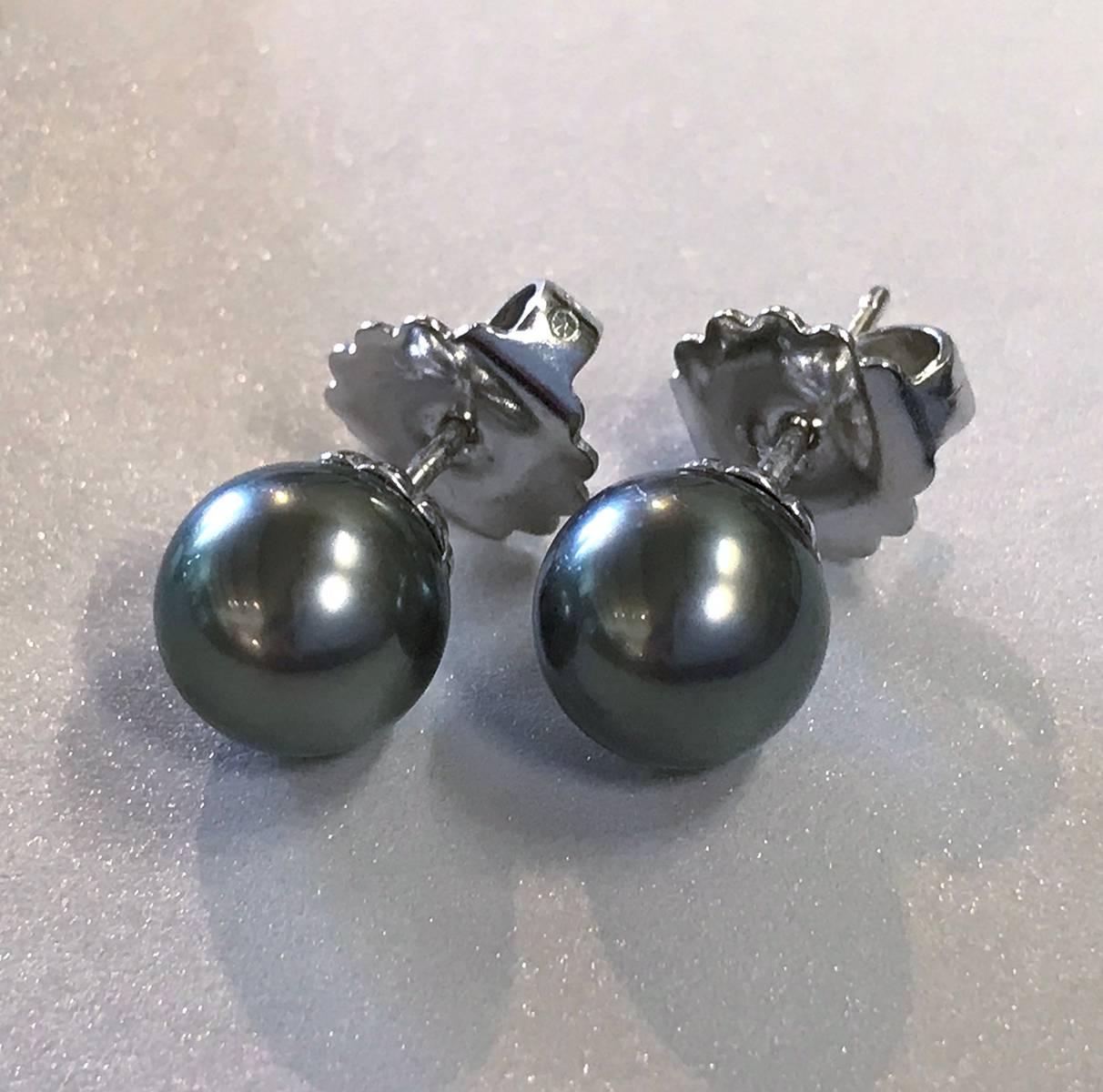 Classic 18k white gold Akoya black cultured pearl earrings. These elegant 9mm pearls will make a great addition to any woman’s jewelry box. Known for their brilliant luster and rich color, Akoya pearls are a traditional symbol of elegance and