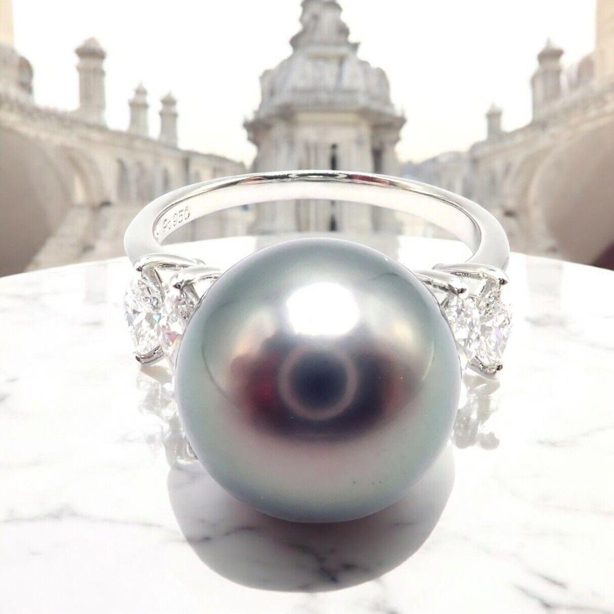 Platinum Diamond Large 12mm Tahitian Pearl Ring by Mikimoto. 
This exquisite Mikimoto Platinum Tahitian Pearl Diamond Ring showcases a captivating Tahitian pearl with a deep, iridescent luster. 
Set in platinum, it is elegantly accented by dazzling