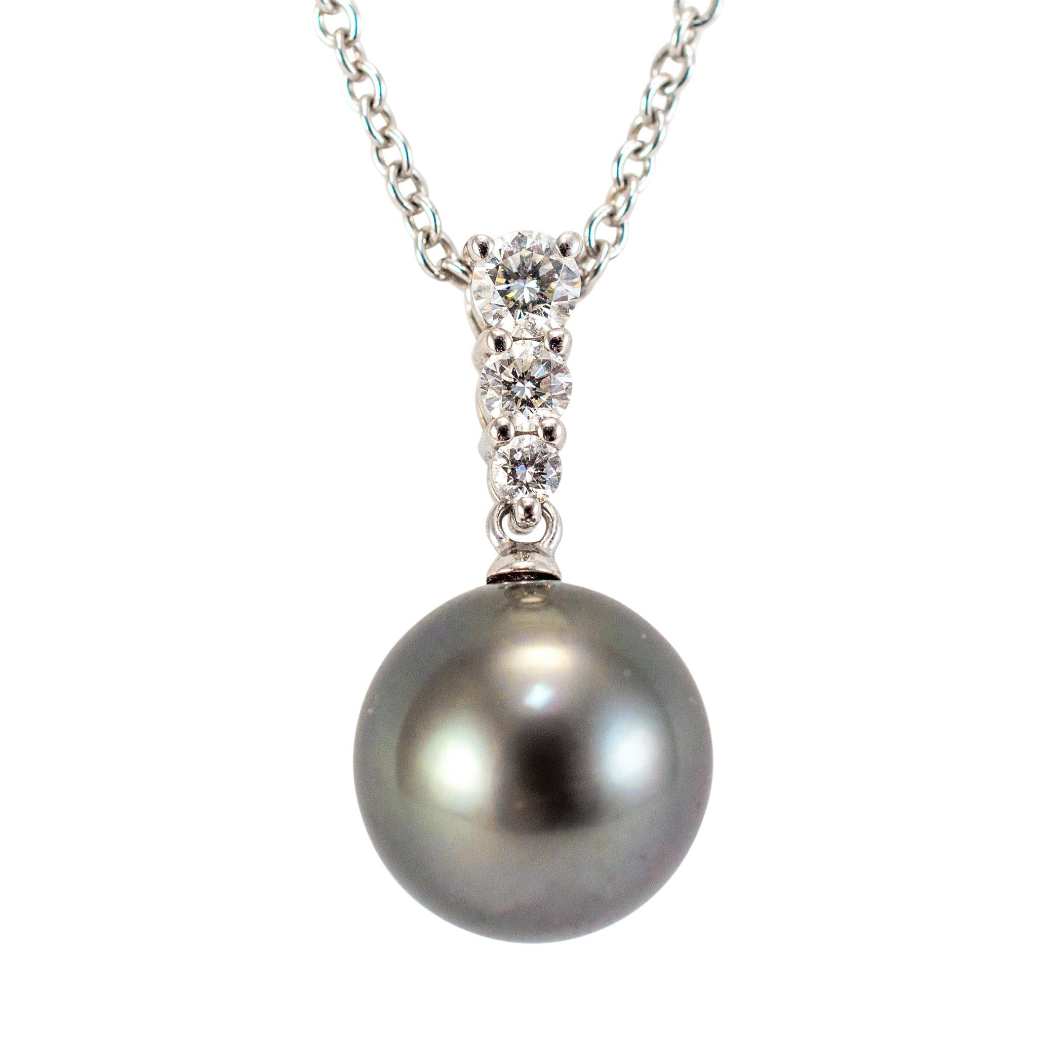 Brand: Mikimoto

Gender: Ladies 

Metal Type: 18K White Gold

Length: 18.00 inches

Weight: 5.90 grams

One ladies 18K white gold single-strand diamond and pearl necklace. The metal was tested and determined to be 18K white gold. Engraved with
