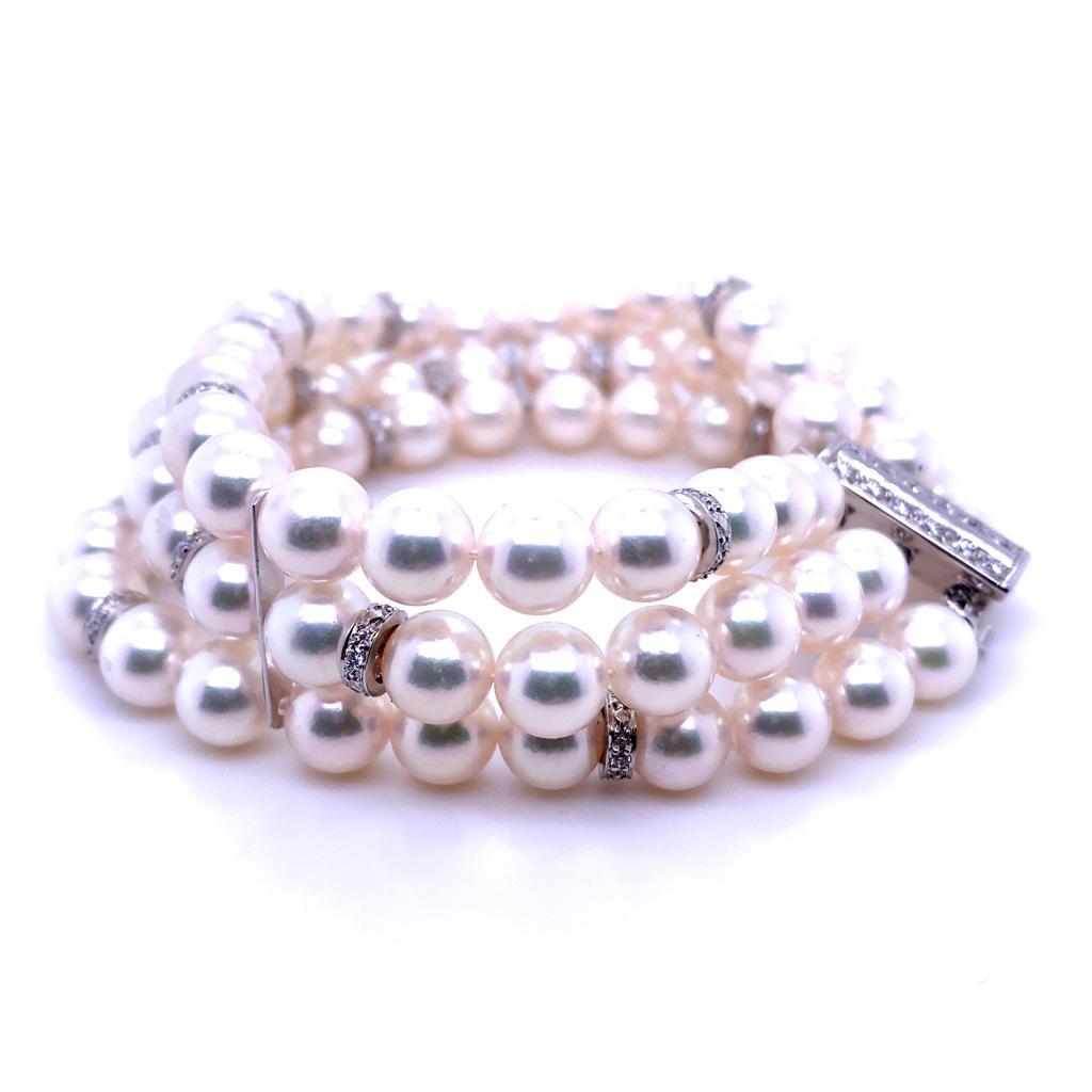 A Mikimoto pearl and diamond 18 karat white gold bracelet.

Designed as an elegant three row bracelet, each of the rows comprises double knotted Akoya cultured pearls of 7mm approximately, interspaced by pavé set round brilliant cut
