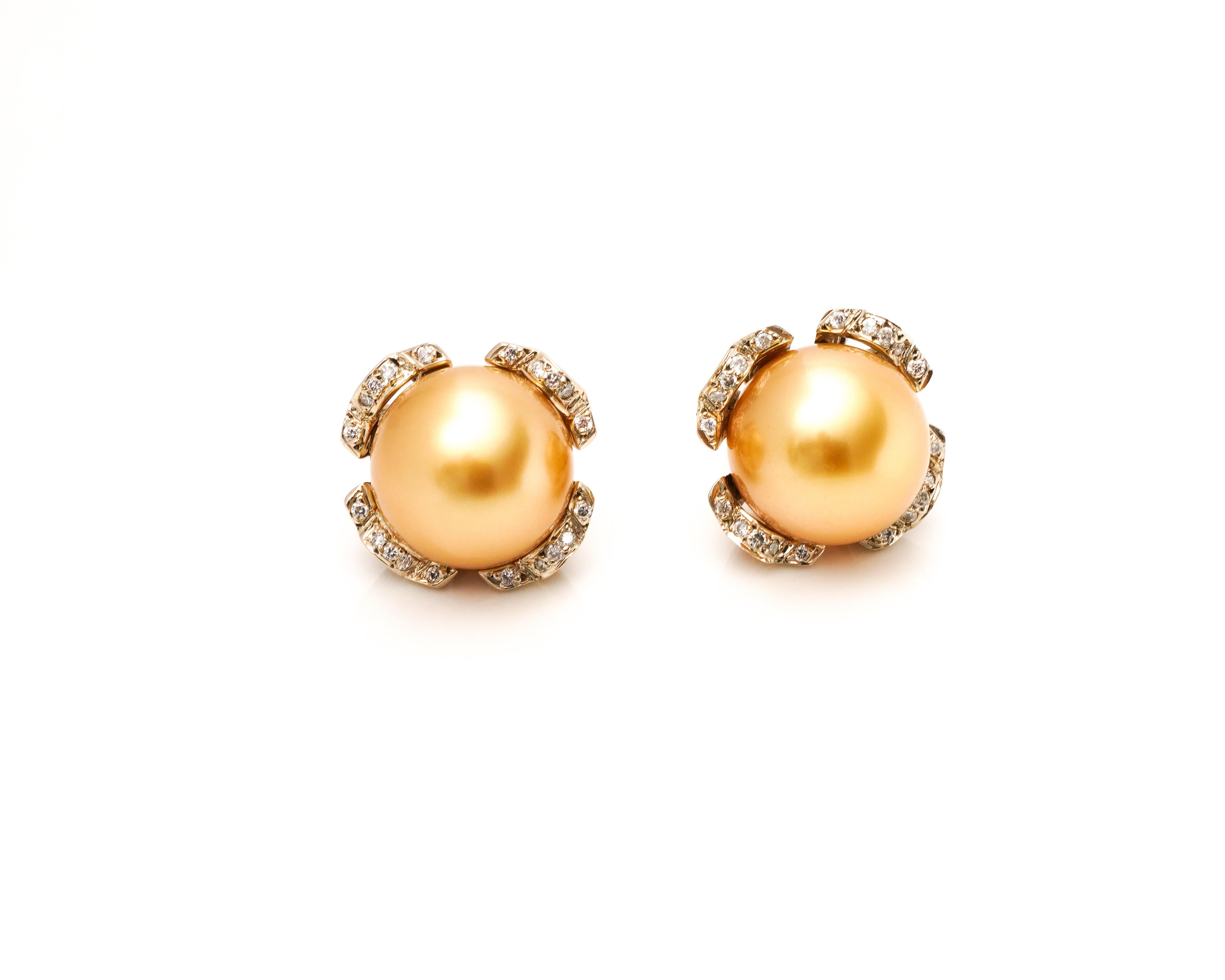 Earring Details:
Metal type: 18 karat White and Yellow Gold
Weight: 8.6 grams
Pearl: 11 millimeter each 

Diamond Basket Details:
This feature is removable. The earrings can be worn alone or as pearl studs in diamond jackets.
Cut: Round
Color: