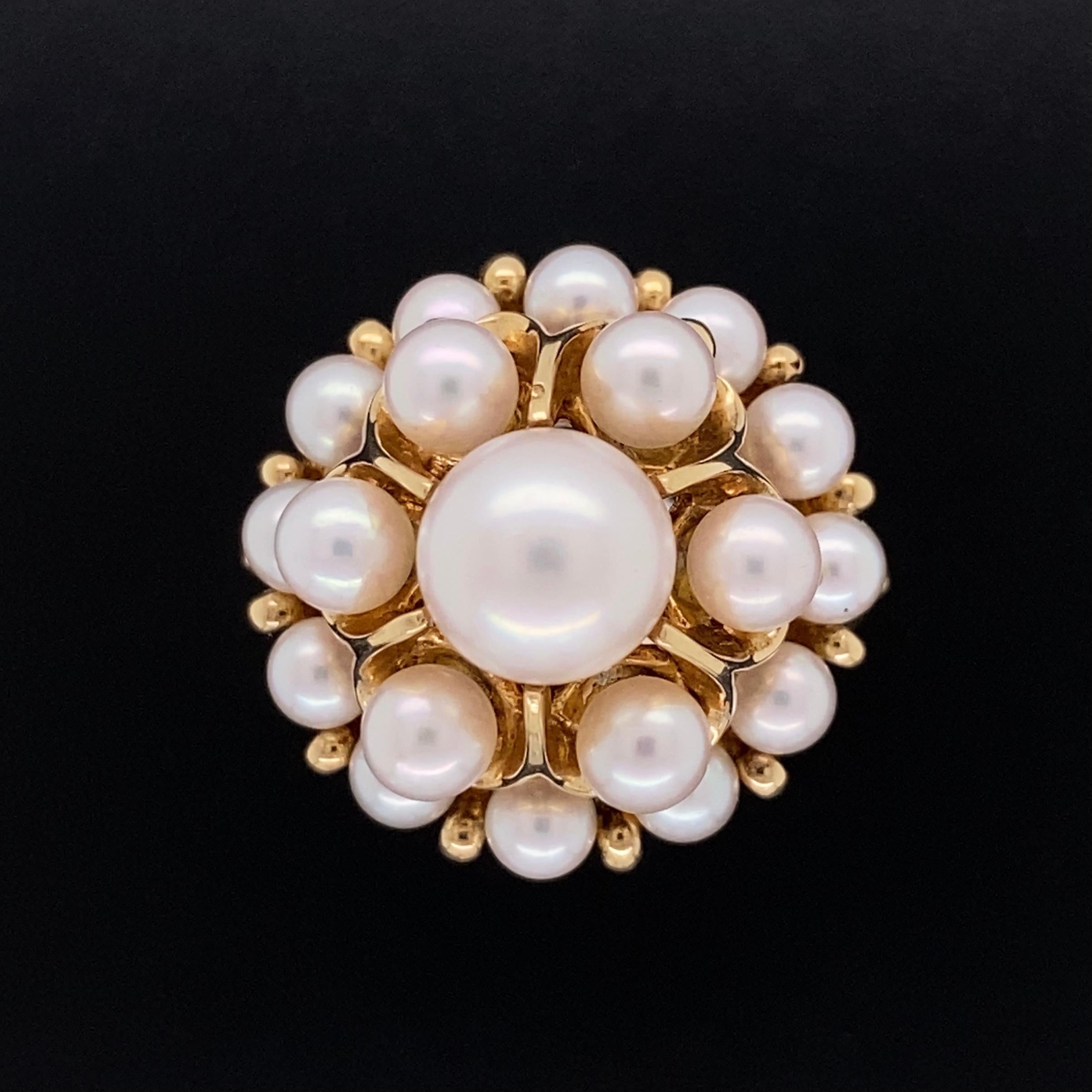 Simply Beautiful and finely detailed Cocktail Cluster Ring, set with 19 Mikimoto Pearls, each measuring approx. 3.4-7mm. Approx. dimensions 0.77”w x 0.73”h x 1.26”d. Hand crafted in 14 Karat Yellow Gold. The ring epitomizes vintage charm, taking you