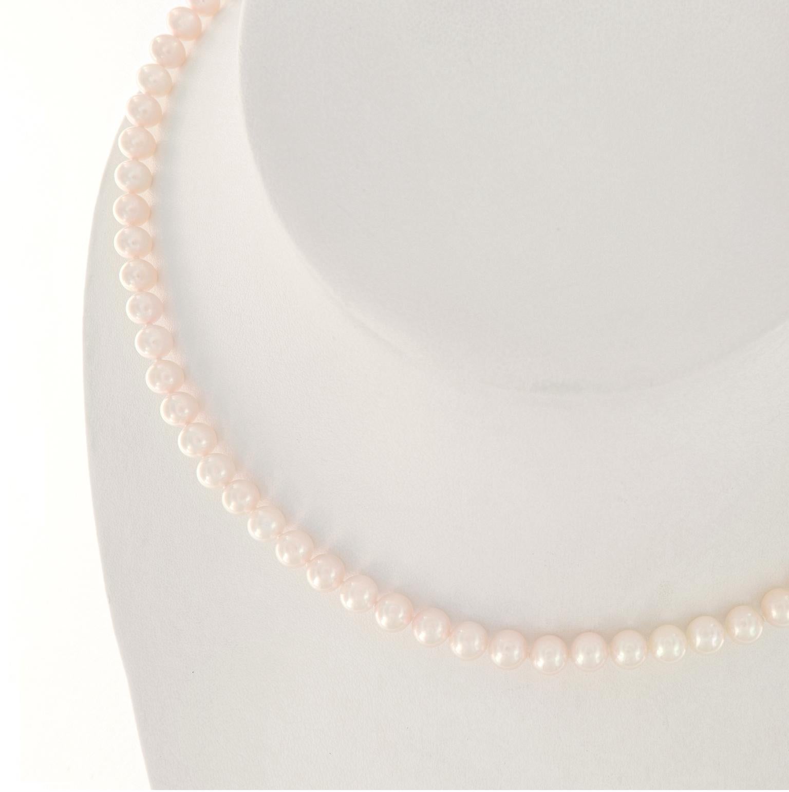 This pretty Mikimoto pearl necklace features 5.5-6.0 mm Akoya pearls and is 18 inches long. The clasp is 18k yellow gold and is set with a pearl at its center. This estate piece is in excellent condition. Weighs 21.8 grams.