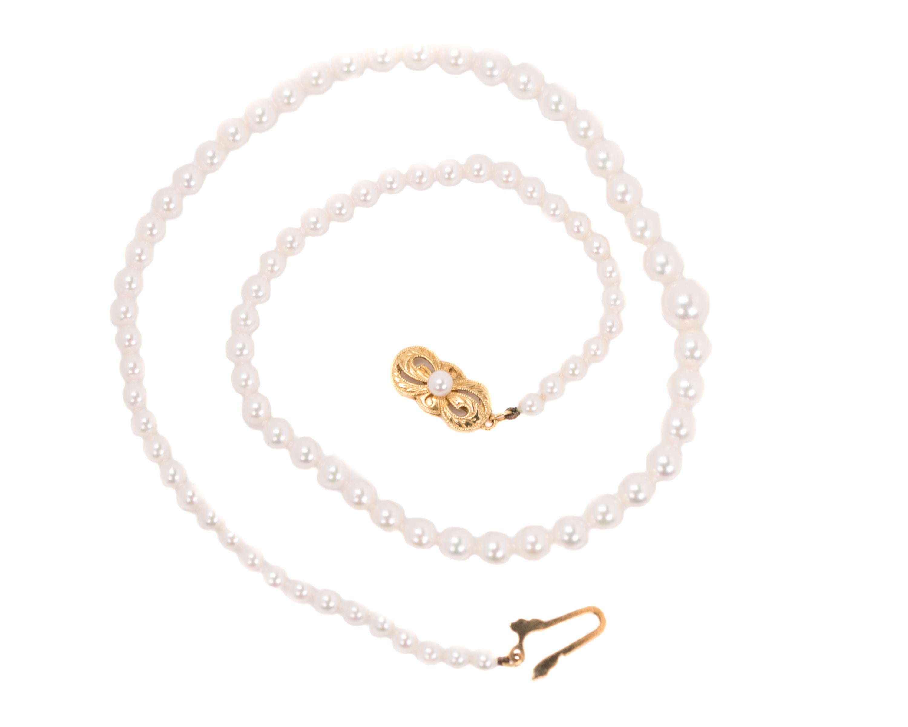 17 inch long Mikimoto Pearl Necklace - 18 Karat Yellow Gold, White Pearls

Features:
18 Karat Yellow Gold Bow shaped clasp
White Pearls graduating in diameter from 7.5 millimeters to 3.5 millimeters
Single Strand 
17 inches long

Necklace