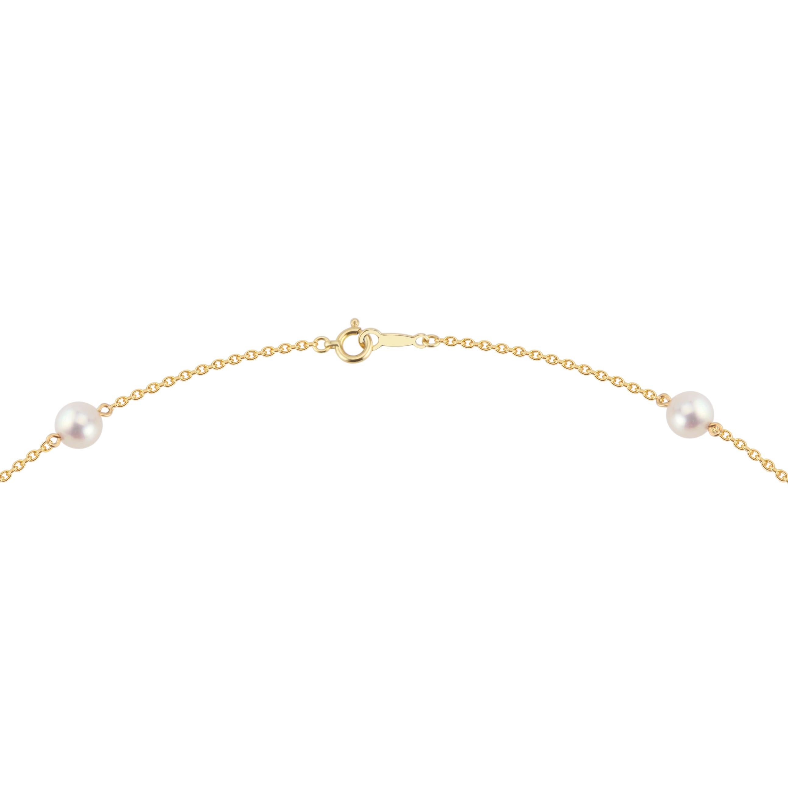 Mikimoto 11 pearl station necklace in 18k yellow gold.  6mm pearls with a rose hue. 18 inches. 

11 cultured rose hue pearls
18k yellow gold 
5.0 grams
Stamped: 750
Hallmark: M
Chain: 18 Inches
