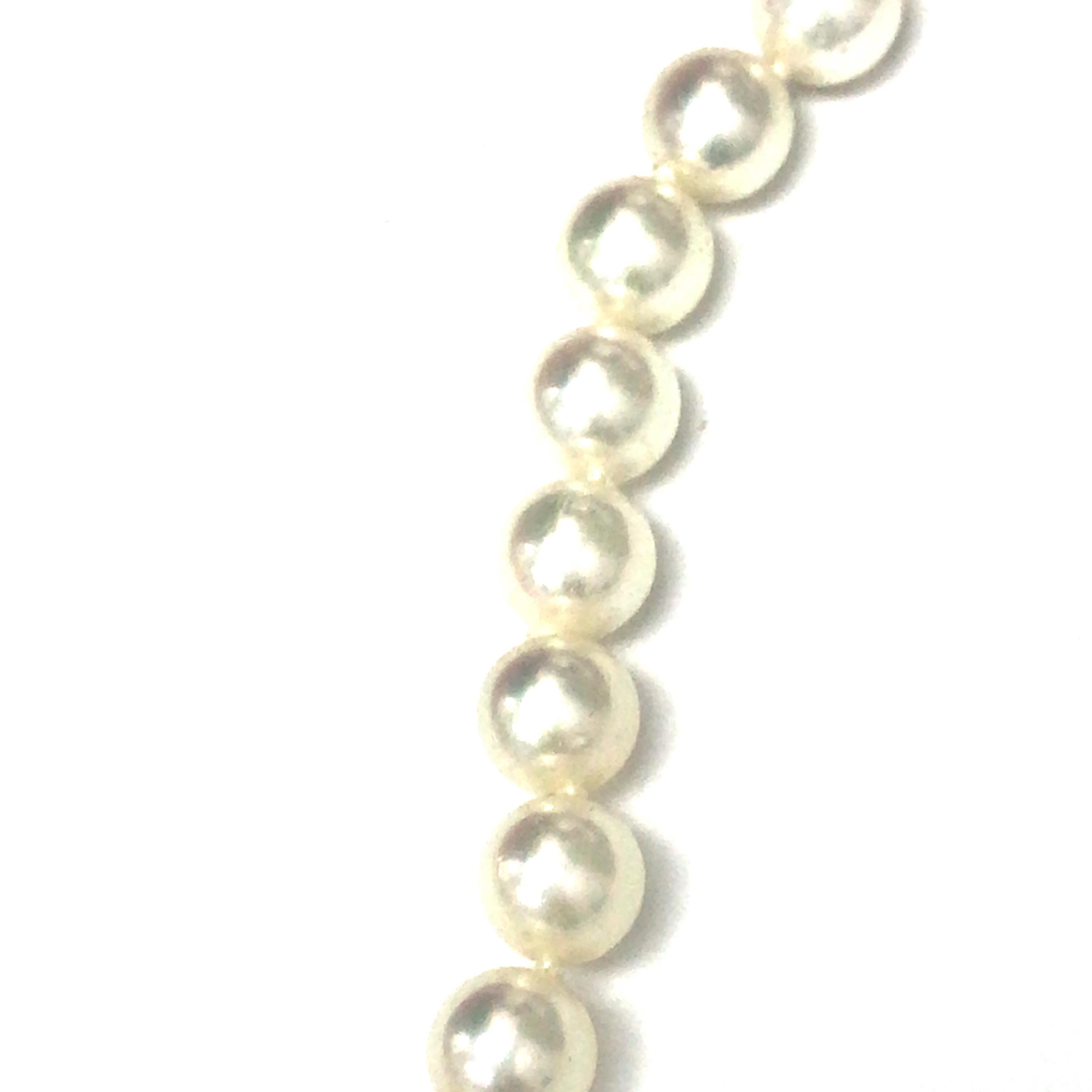 Mikimoto Pearl Strand 18K Yellow Gold Bow Clasp.  Stamped 750 MI.  17 1/2 inch in length.
