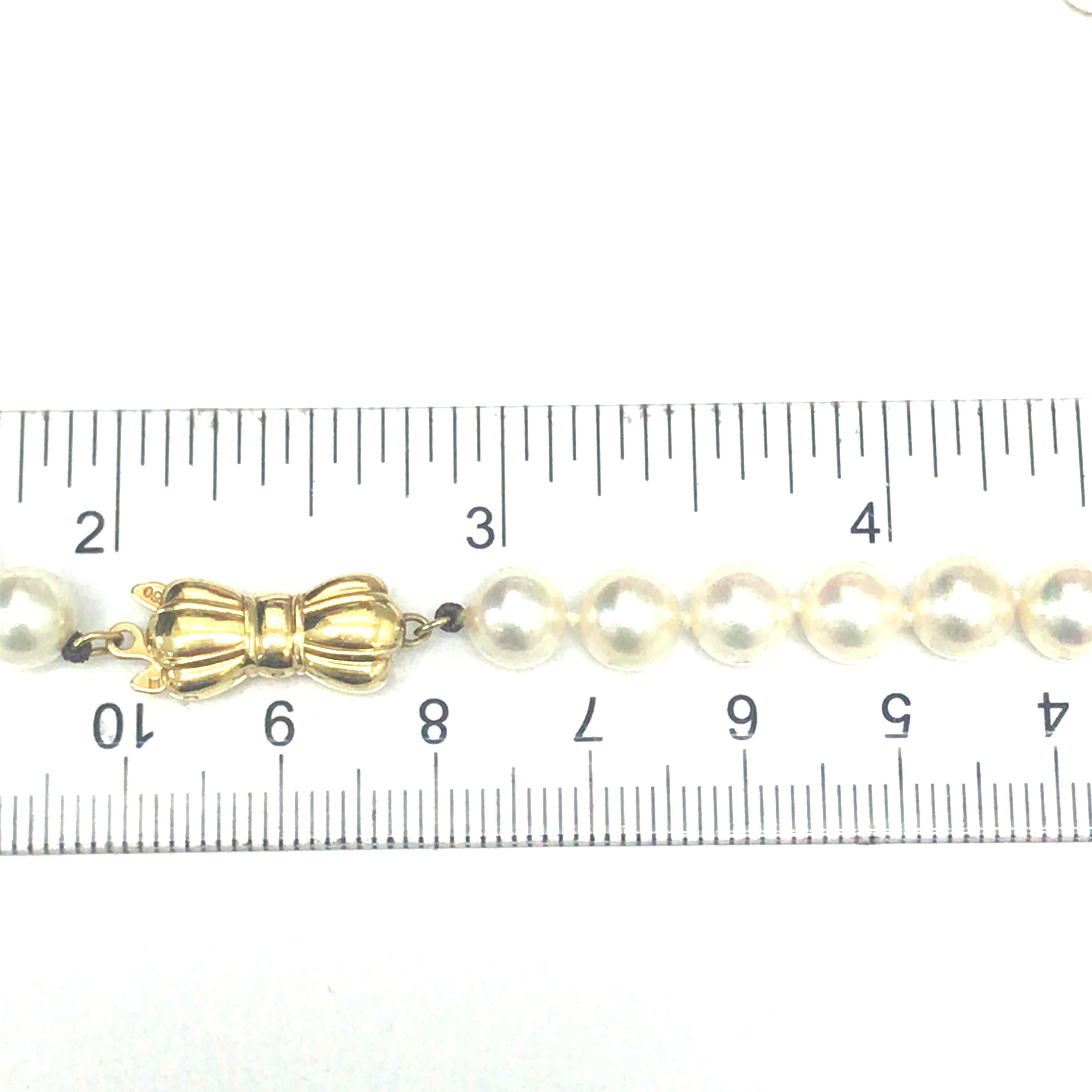 Mikimoto Pearl Strand 18K Yellow Gold Bow Clasp In Excellent Condition For Sale In Boca Raton, FL