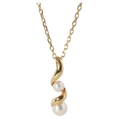 Used Mikimoto Pendant. 18k Gold Mikimoto Swirl Pearl Necklace.