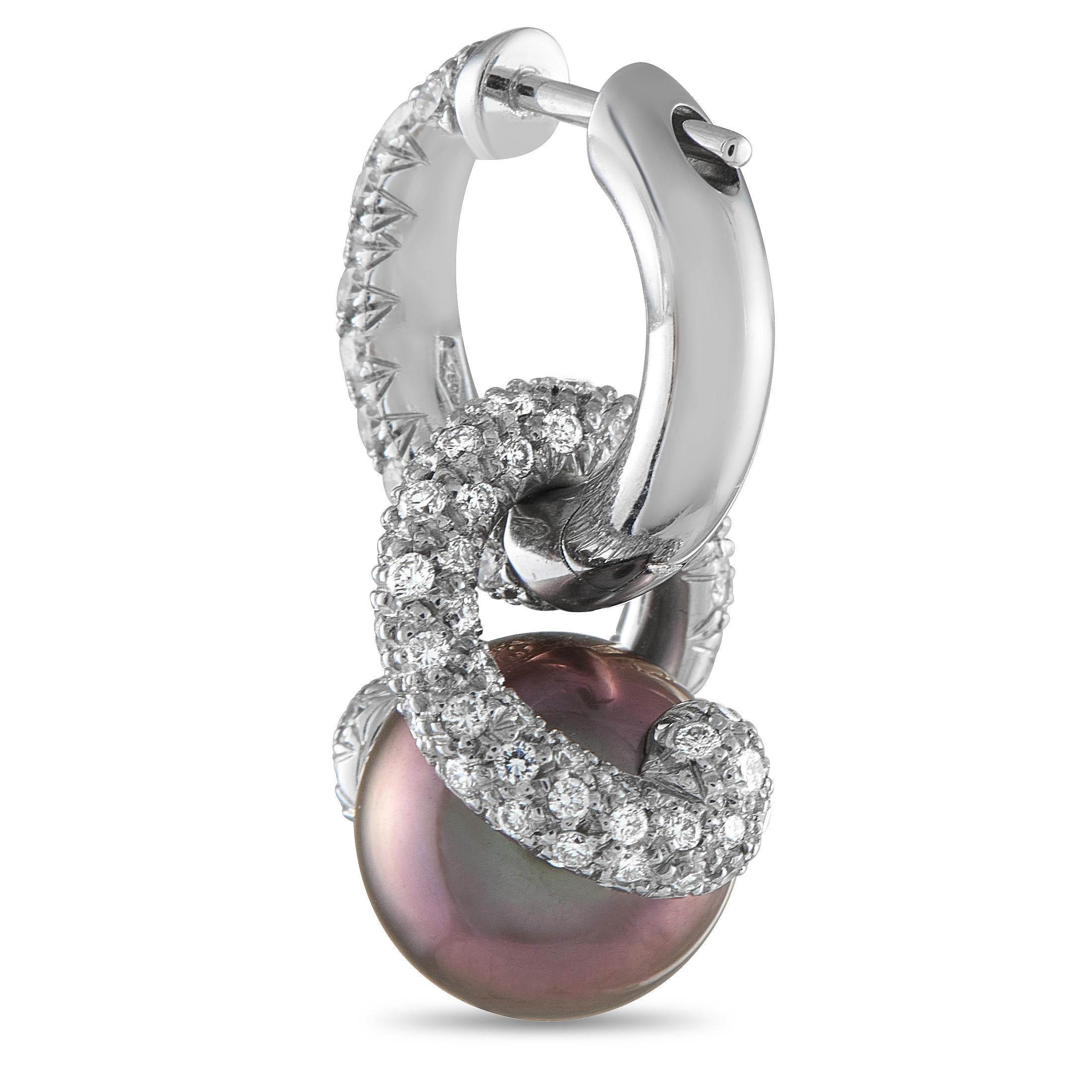 In this Mikimoto pair of earrings, the bold presence of 9.5mm pinkish-purple South Sea pearls meets the brilliant charm of petite white diamonds. Together, they create a look that's fresh yet timeless.This brand new pair of Mikimoto Placamos 18K