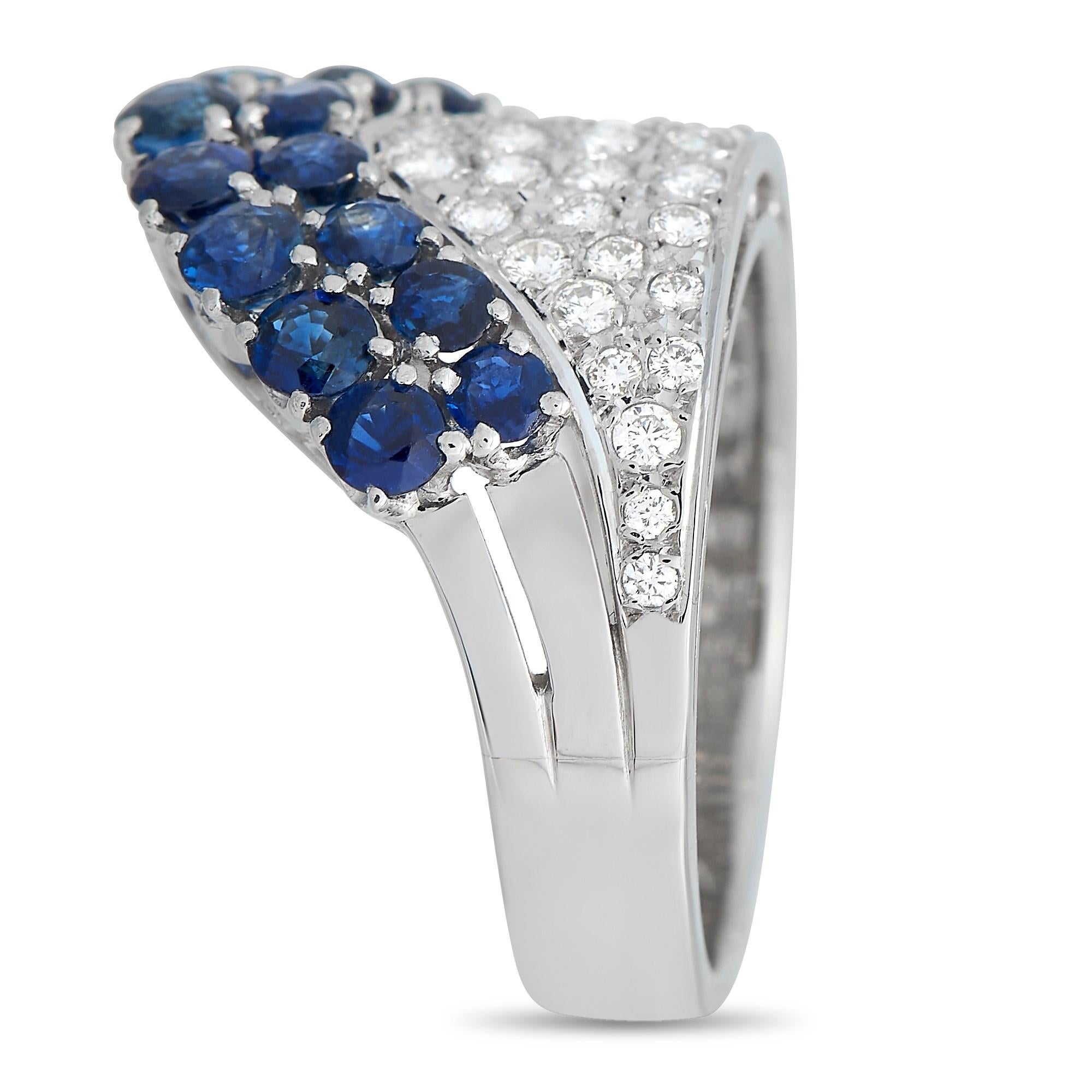 This breathtaking Mikimoto ring features an incredible array of gemstones accenting the Platinum setting. Sparkling inset diamonds totaling 0.50 carats contrast beautifully against the stunning round-cut sapphires, which together possess a total