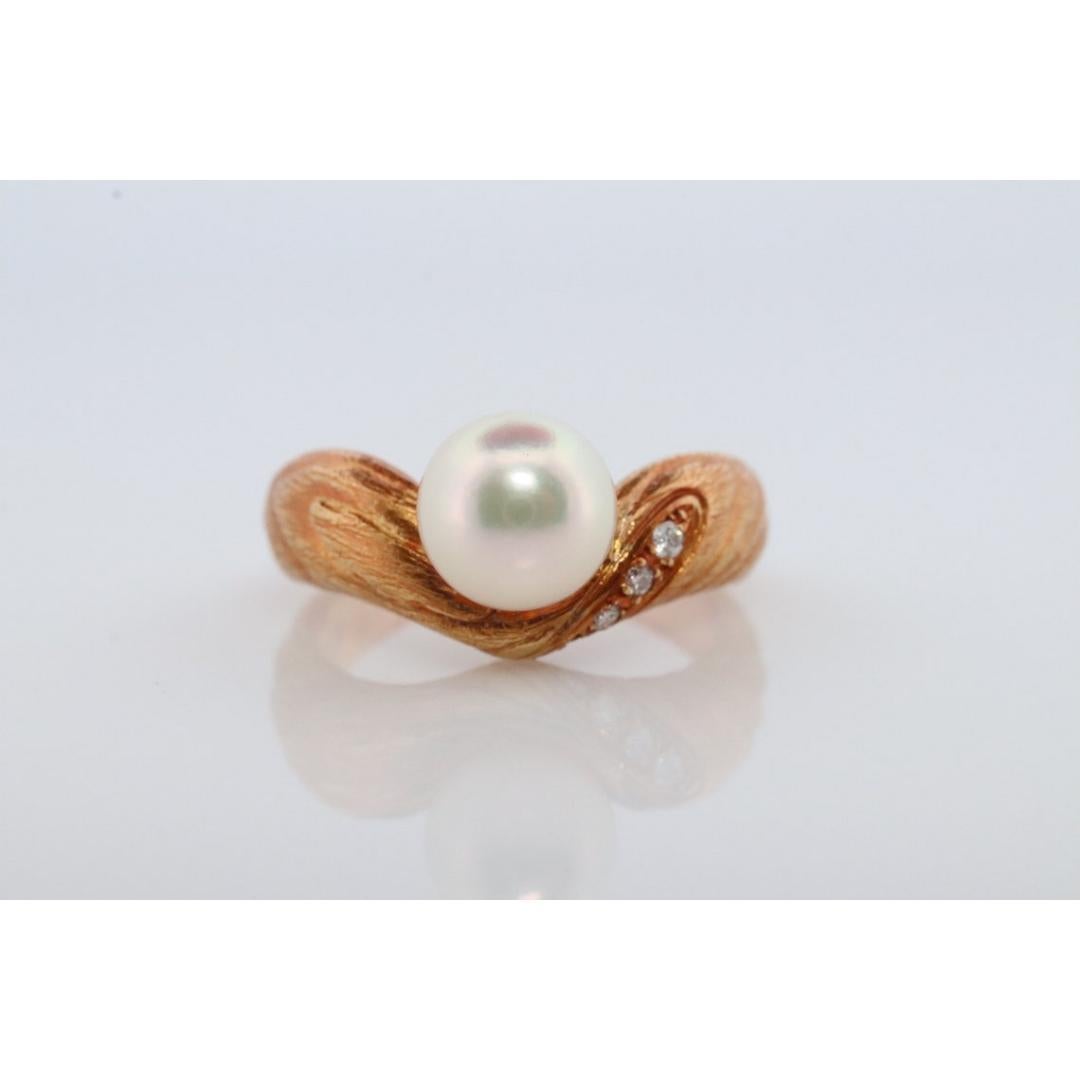 Vintage from the 1990s
Size: 5 1/2 US
Materials: Gold, Platinum

Gemstone: Pearl

Style: Minimalist

Genuine MIKIMOTO ring

18k Yellow Gold Diamonds and Pearls

MIKIMOTO Natural Bark motif

Details:
Size 5.5
Akoya pearl 7mm
1.5mm diamonds
5.8grams
