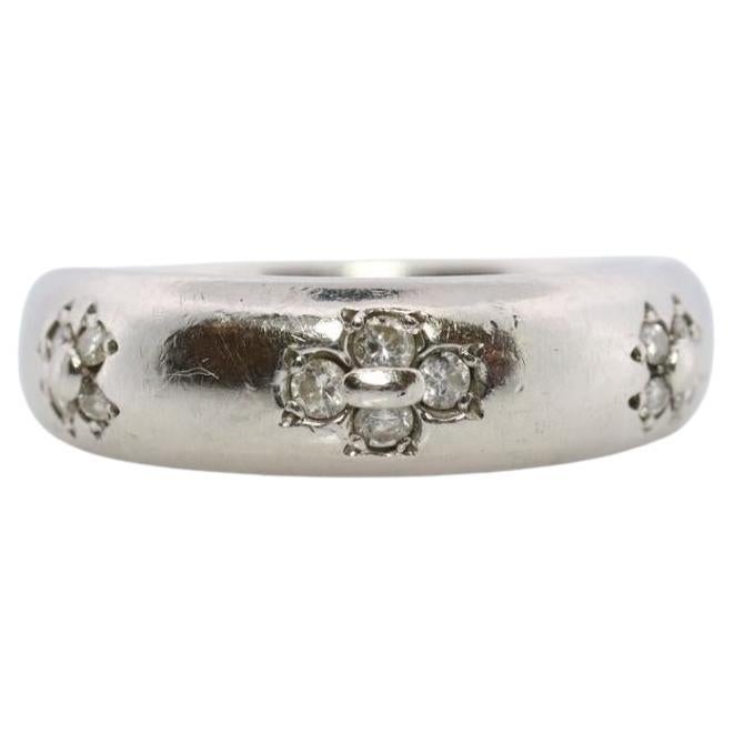 Mikimoto Ring. Vintage Platinum Mikimoto Diamond Bezel set ring.
