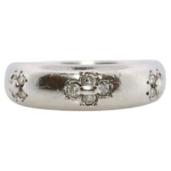 Mikimoto Ring. Vintage Platinum Mikimoto Diamond Bezel set ring.